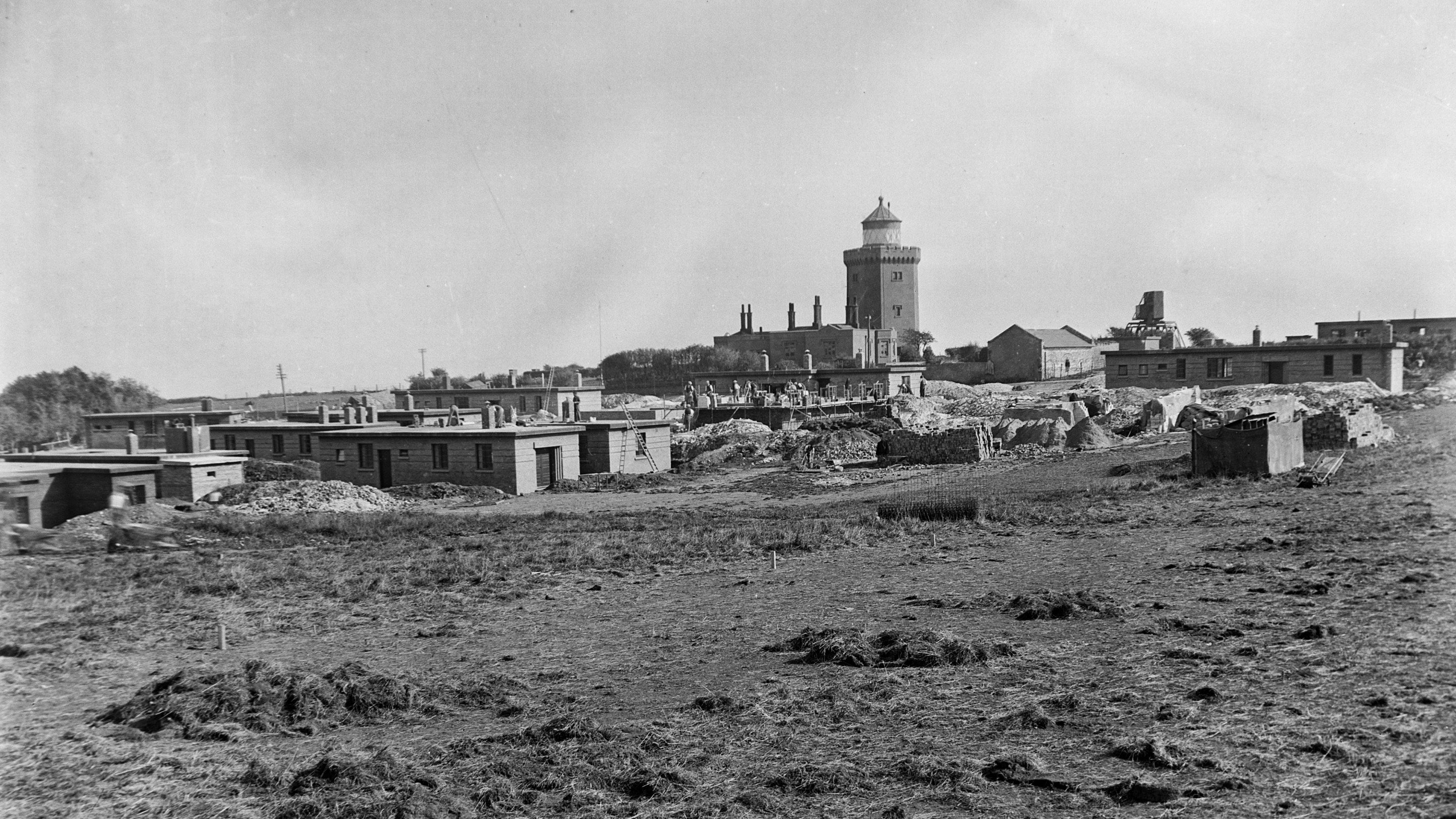 Image of South Foreland Lighthouse painted grey and surrounded by Second World War buildings under construction