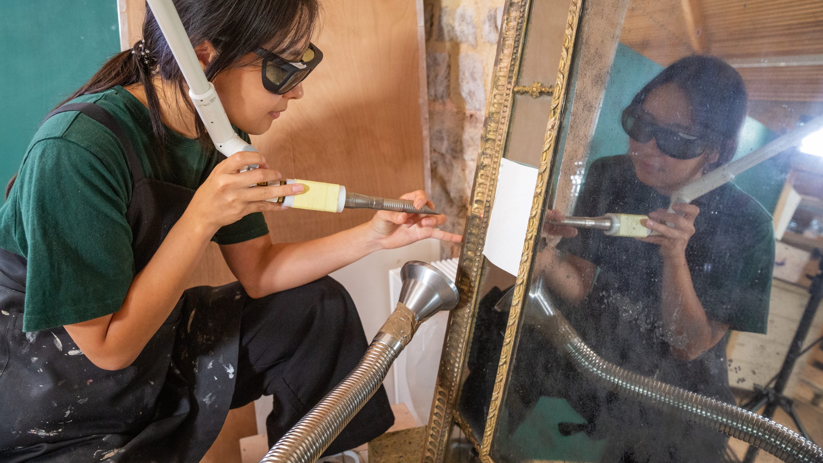 Ongoing conservation work on a giltwood mirror from Nunnington Hall by the Royal Oak Foundation Conservation Studio at Knole, Kent