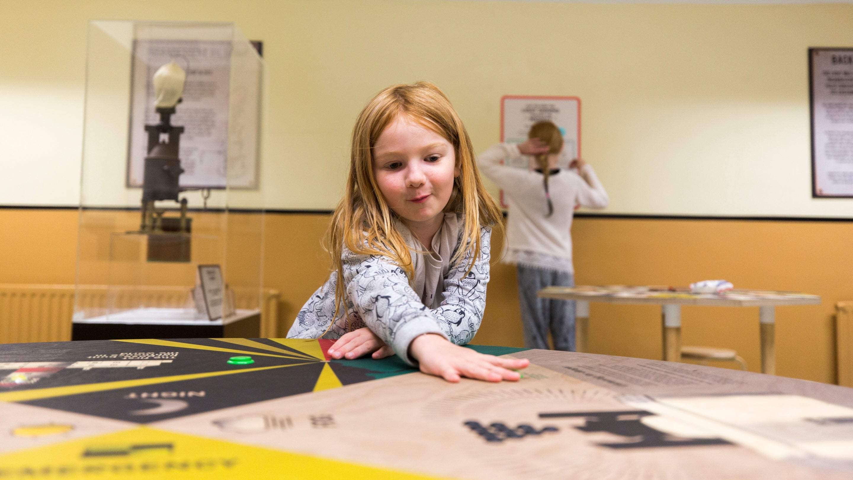 A pupil engaging with an activity in a room at the lighthouse