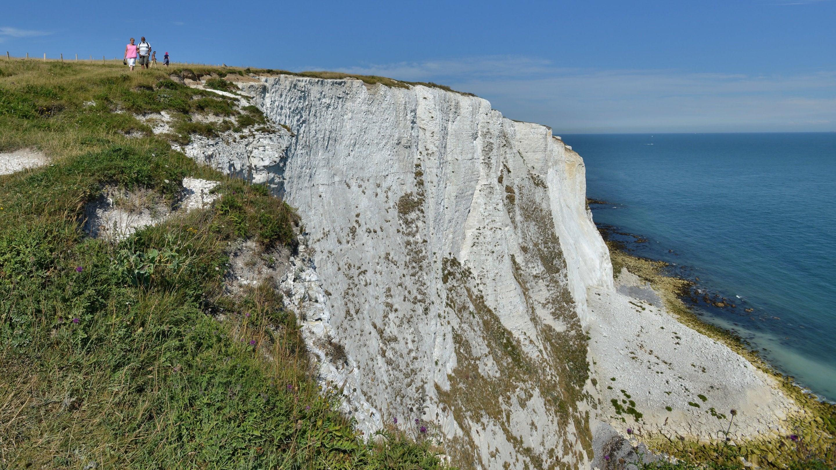 An image of the White Cliffs of Dover on a sunny day with blue skies
