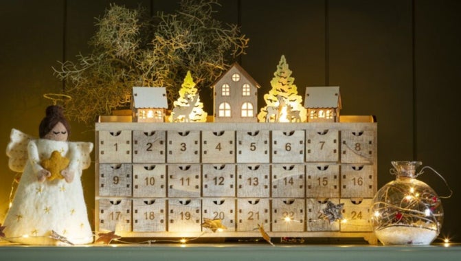 Image of a wooden Advent Calendar with drawers to open for the 24 days