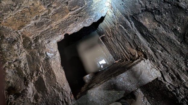 A view into the 4.5 metre deep inspection chamber with water in the bottom