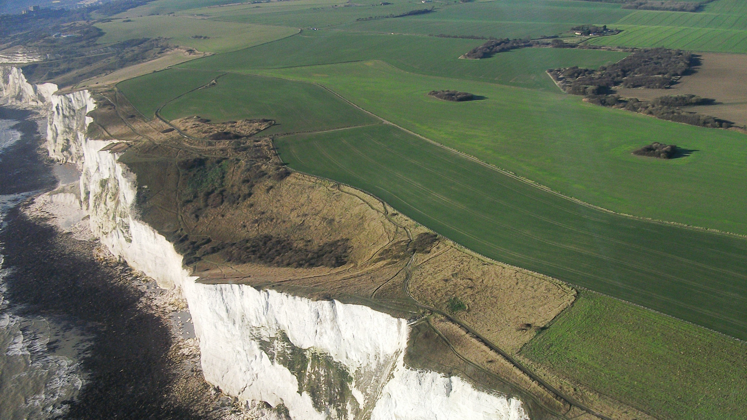 Image of the White Cliffs of Dover from the air including the shallow bowl-shaped valley of Fan Hole