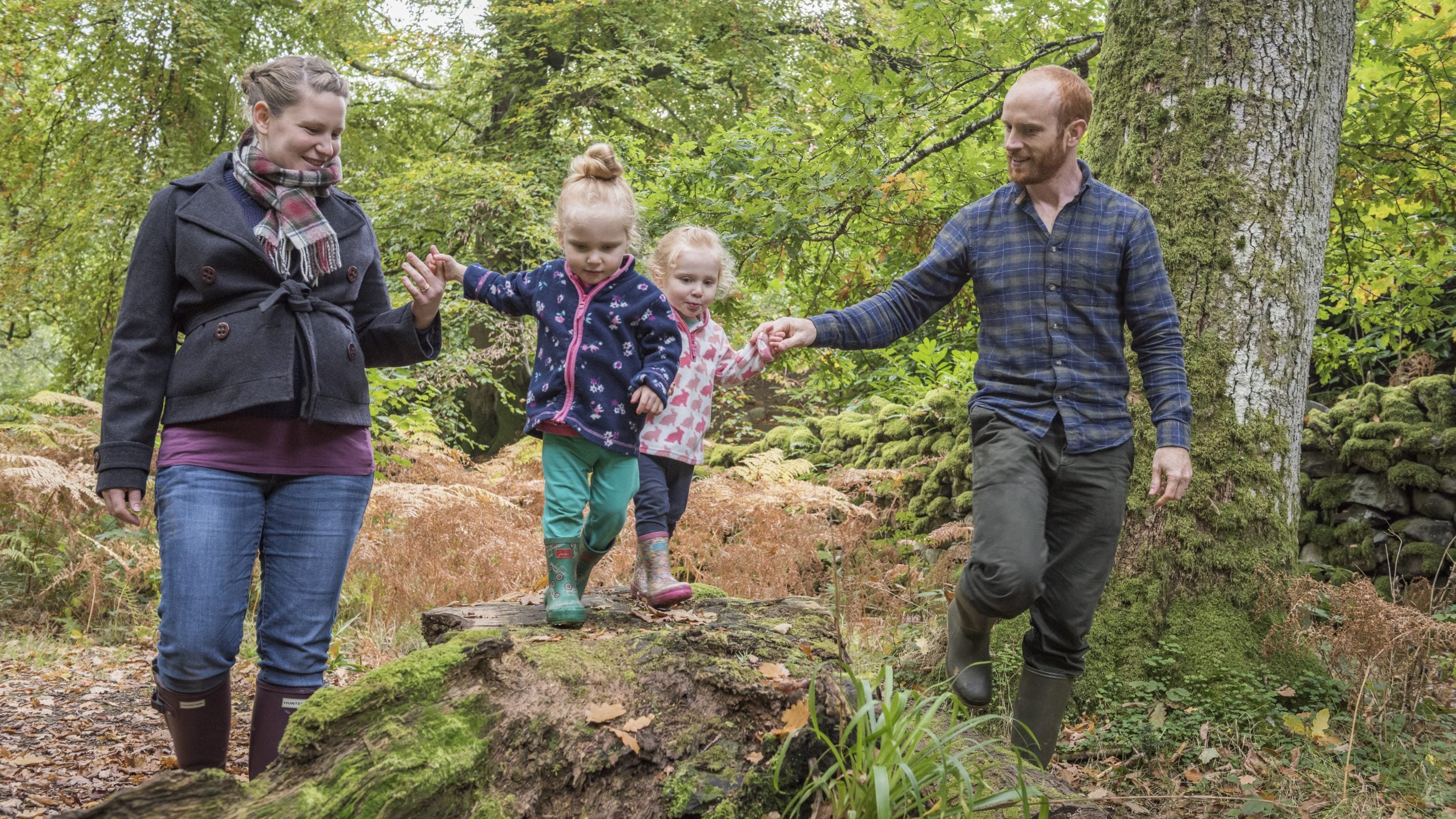 A family enjoying the woodland trails at Aira Force and Ullswater, Cumbria