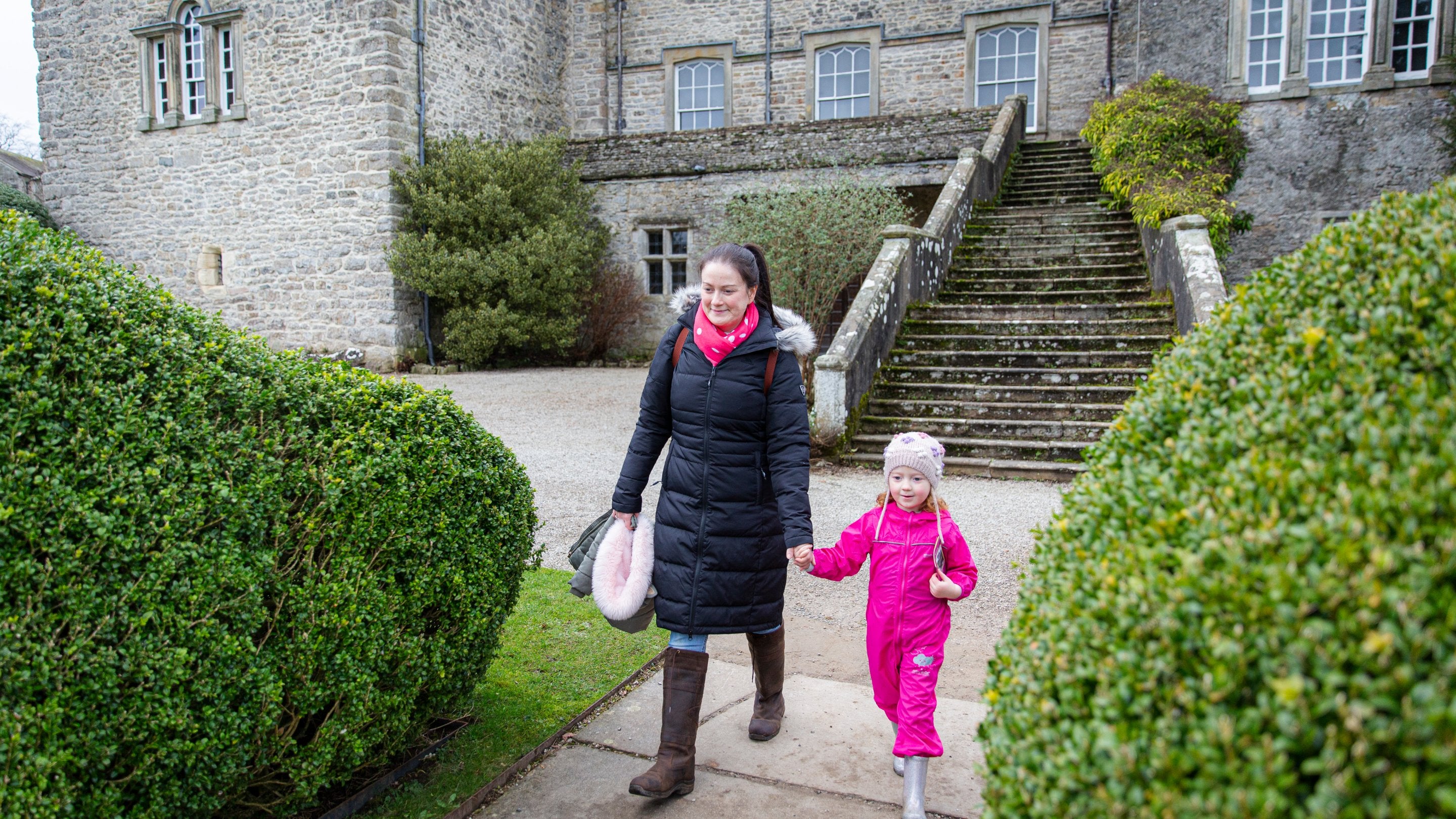 Visitors exploring the winter garden at Sizergh, Cumbria