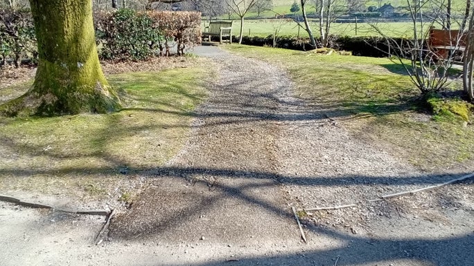 Broken tarmac path leading from Broadgate Car Park at step 1, Allan Bank and Grasmere, Cumbria