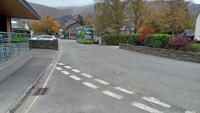 A wide road junction lined with stone walls and buildings, Allan Bank and Grasmere, Cumbria