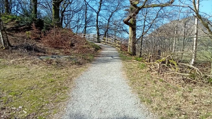 Uphill gravel path lined through grass and scrubland, Allan Bank and Grasmere, Cumbria