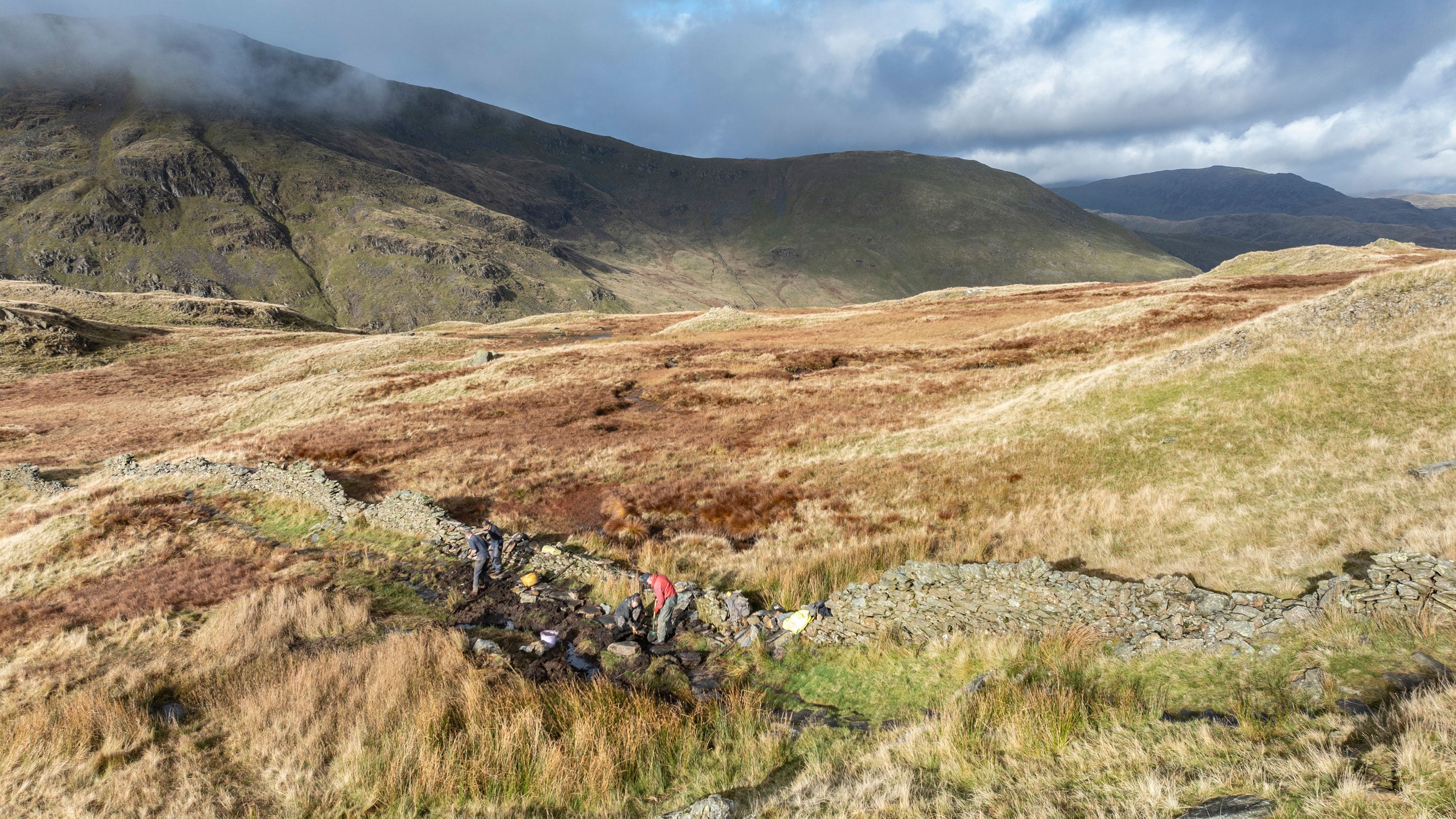 Aerial view of rangers restoring the path with the help of volunteers as part of the Fix the Fells project at Ravens Edge, Kirkstone Pass, Cumbria