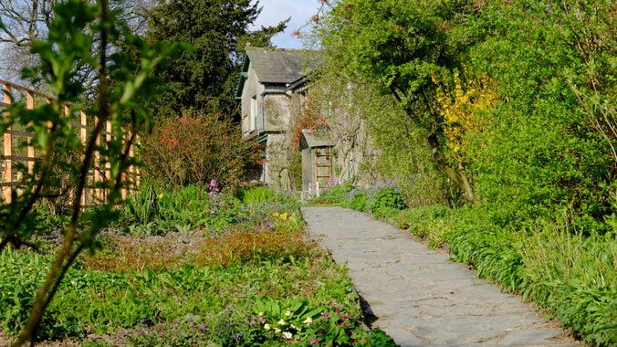 View up the garden path at Hill Top, Cumbria, in spring.