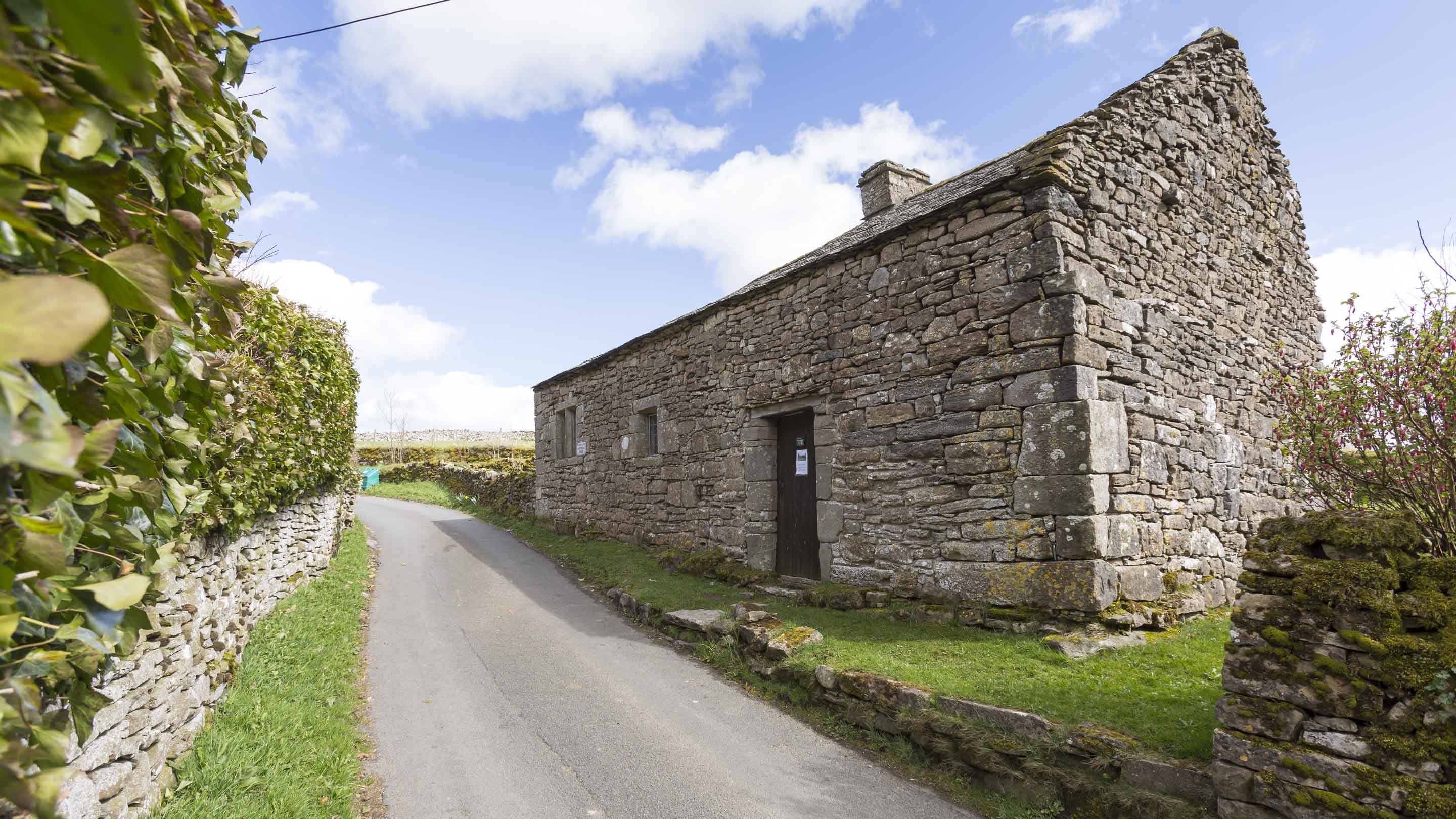 A sunny spring view of the front of Keld Chapel, Shap, Cumbria