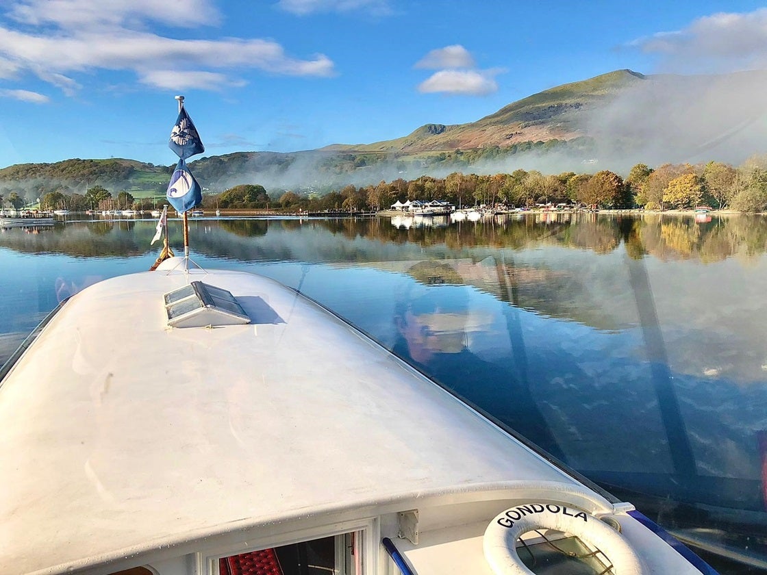 An autumnal scene from the deck of Gondola showing her steaming down the lake