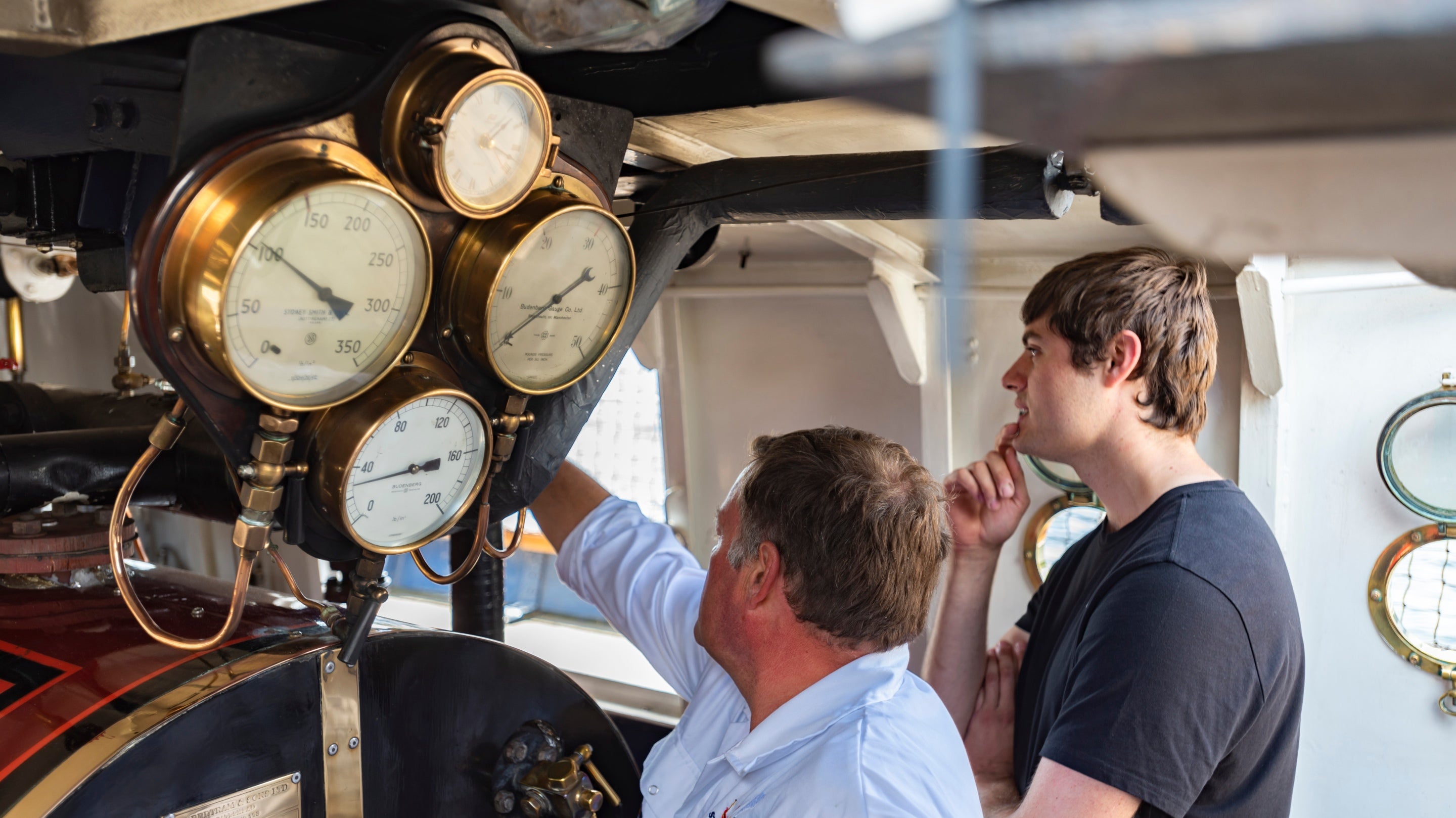 Crew members in the Engine Room on Steam Yacht Gondola on Coniston Water, Lake District