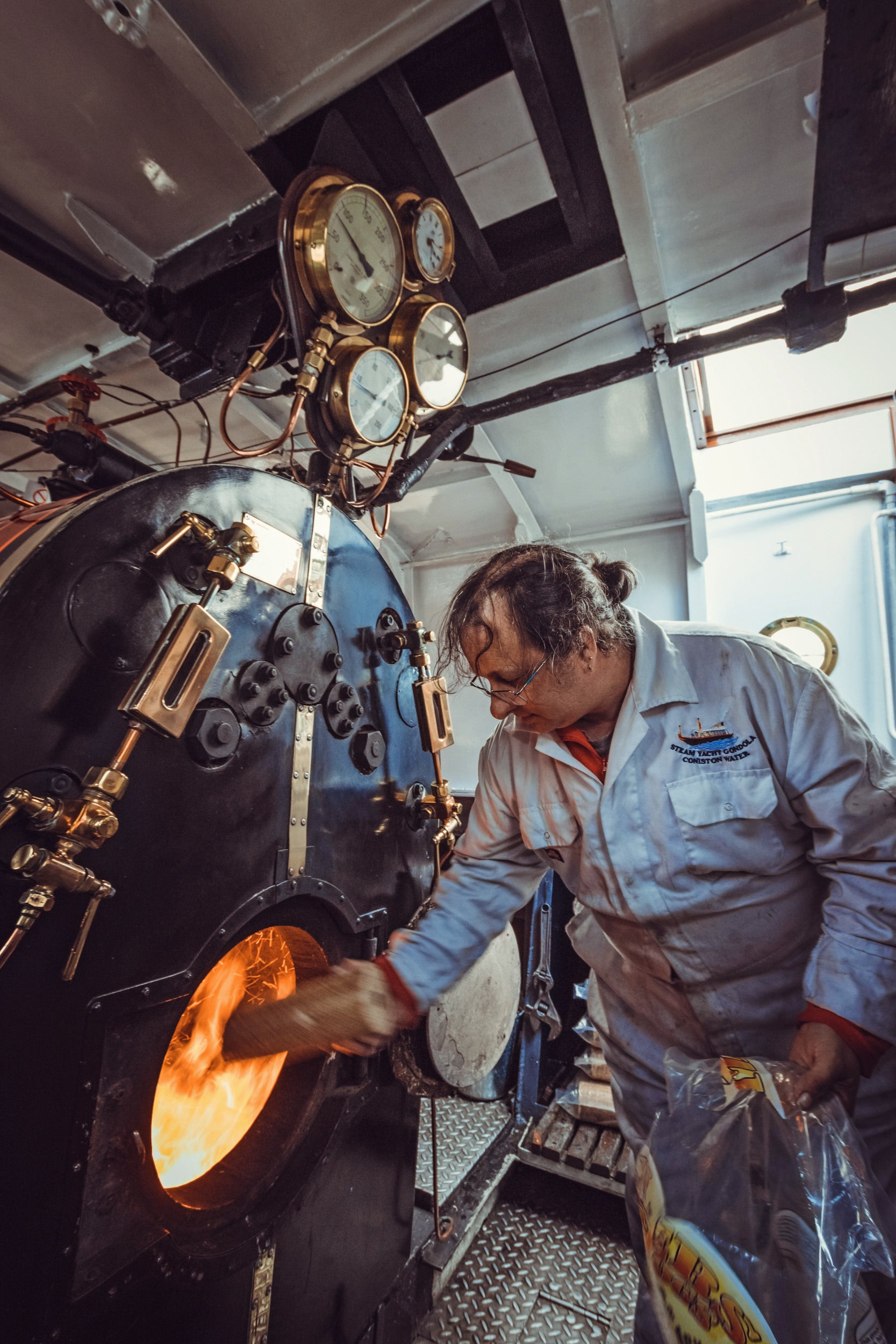 Crew of Steam Yacht Gondola attending the firebox