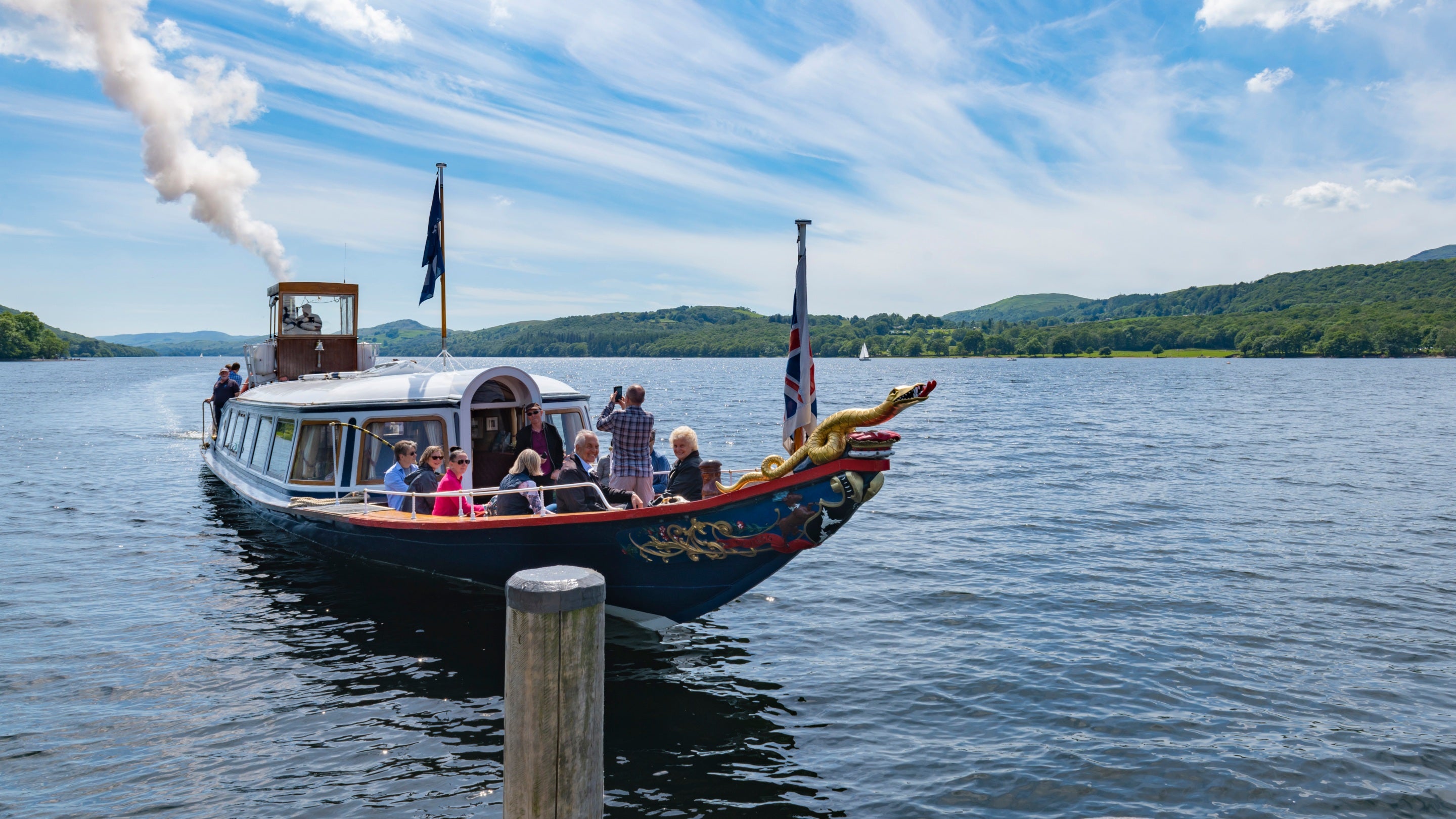 The Steam Yacht Gondola full of passengers on Coniston Water in the Lake District, Cumbria