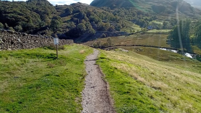 Small gravel footpath across the field going down to Skater's Bridge, Little Langdale, Cumbria