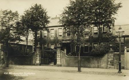 Black and white picture postcard of the front of Wordsworth House and Garden taken from main street before 1932