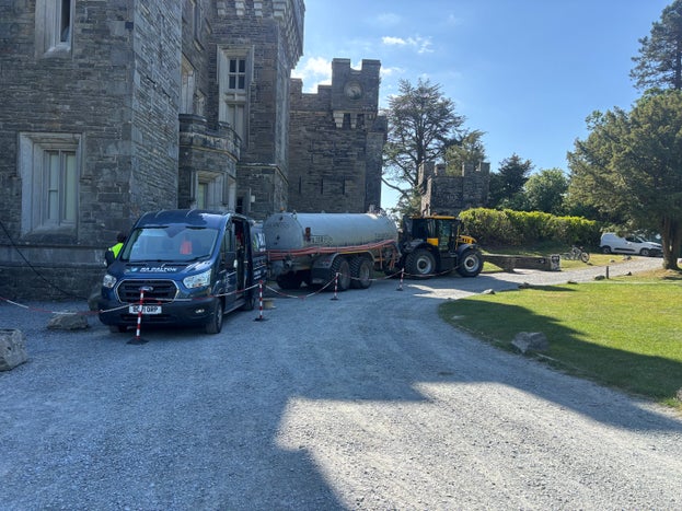 Tractor and water tanker parked outside Wray Castle for Surface water testing as part of restoration project