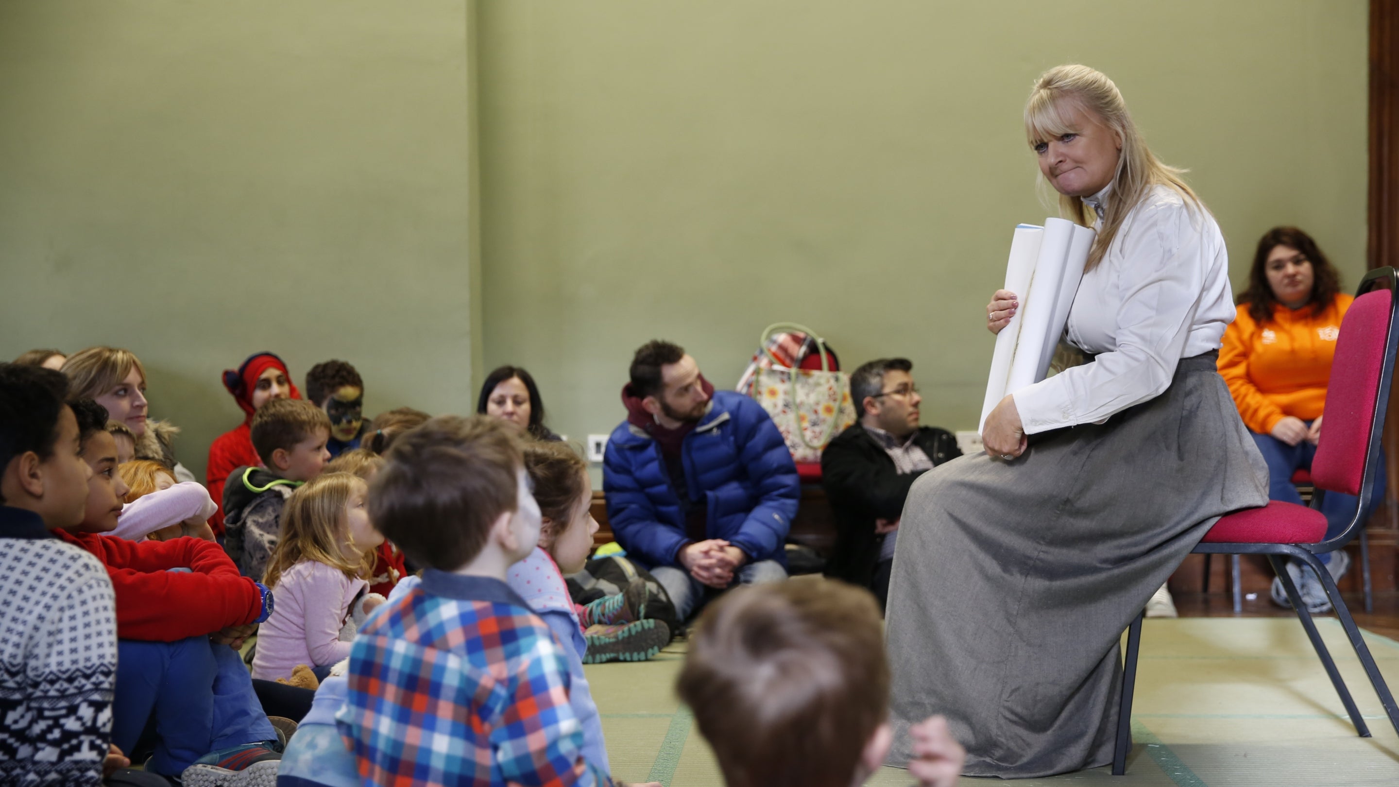 Volunteer dressed at Beatrix Potter reading at the National Trust Children's Book Festival at Wray Castle, Cumbria