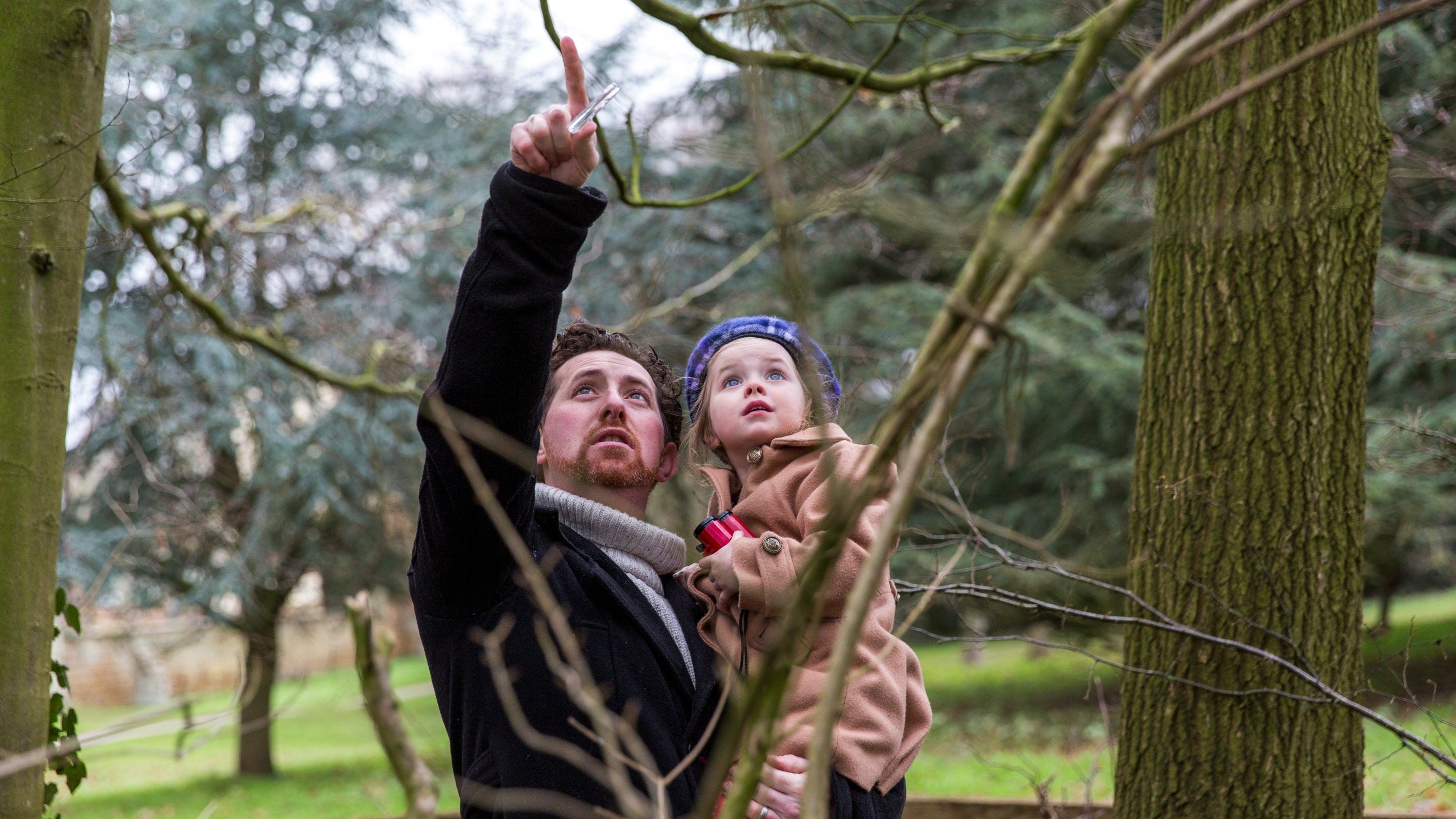 Visitors in the natural play area in winter at Canons Ashby, Northamptonshire