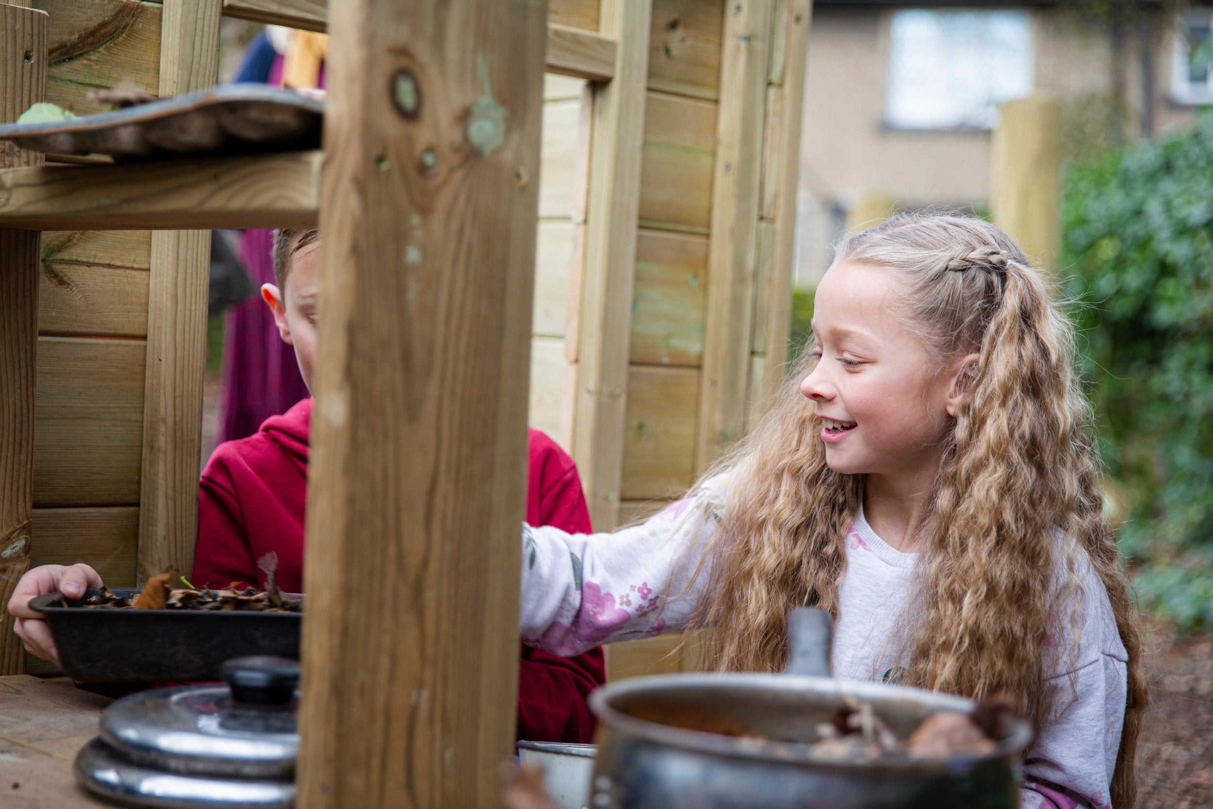 Children playing in the mud kitchen