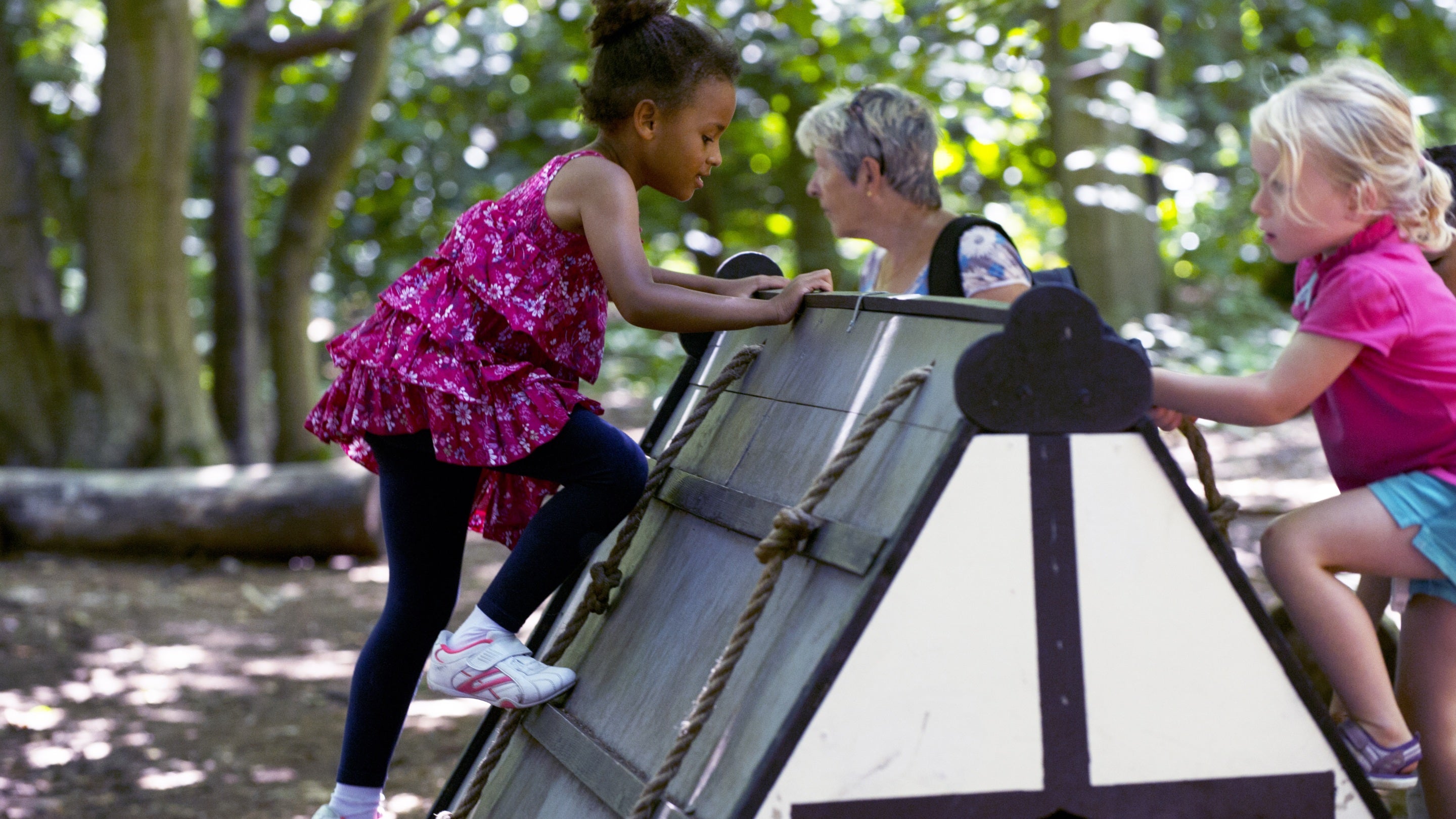 Children climbing in the grounds of Speke Hall, Liverpool