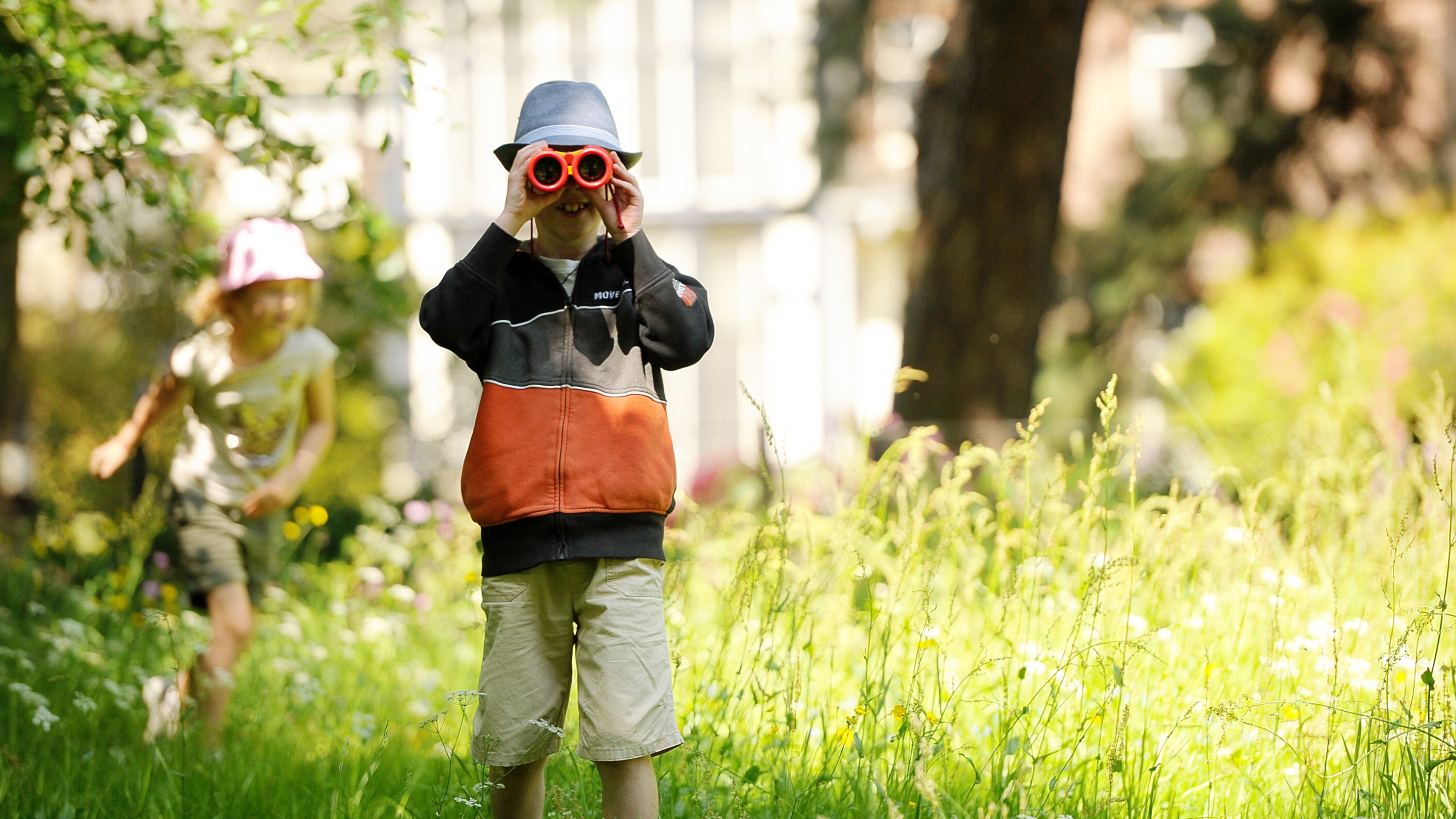 Children exploring the garden at Rufford Old Hall, Lancashire