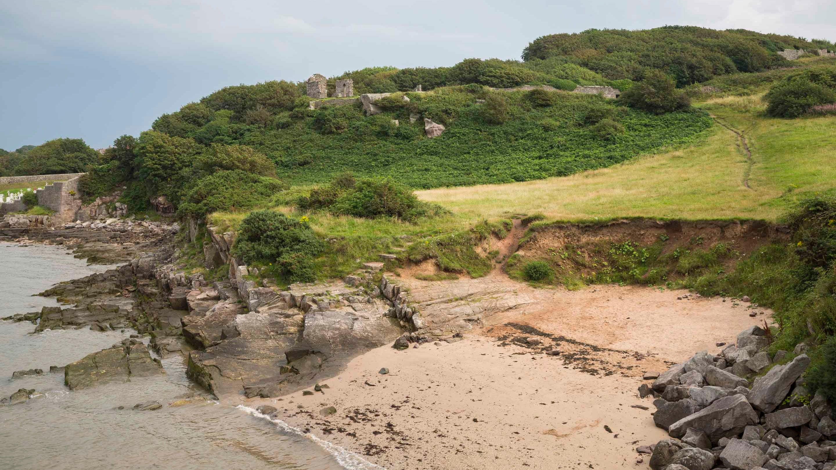 View towards the eighth century chapel from the beach at Heysham Coast, Lancashire