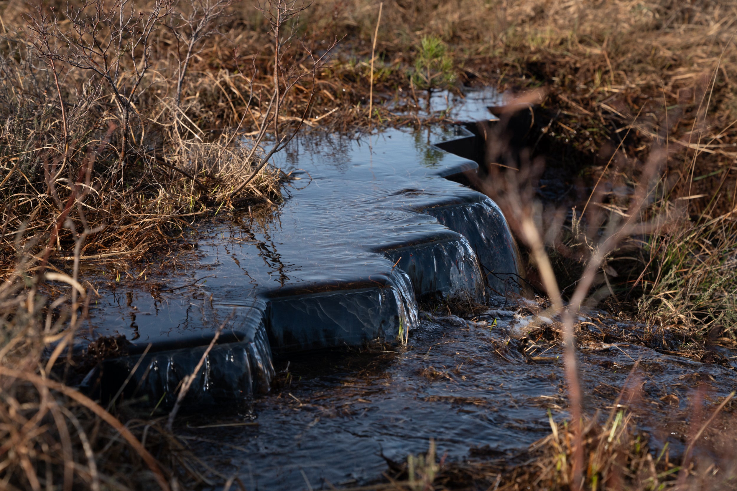 Weirs installed to reduce water flow and loss of water across the site