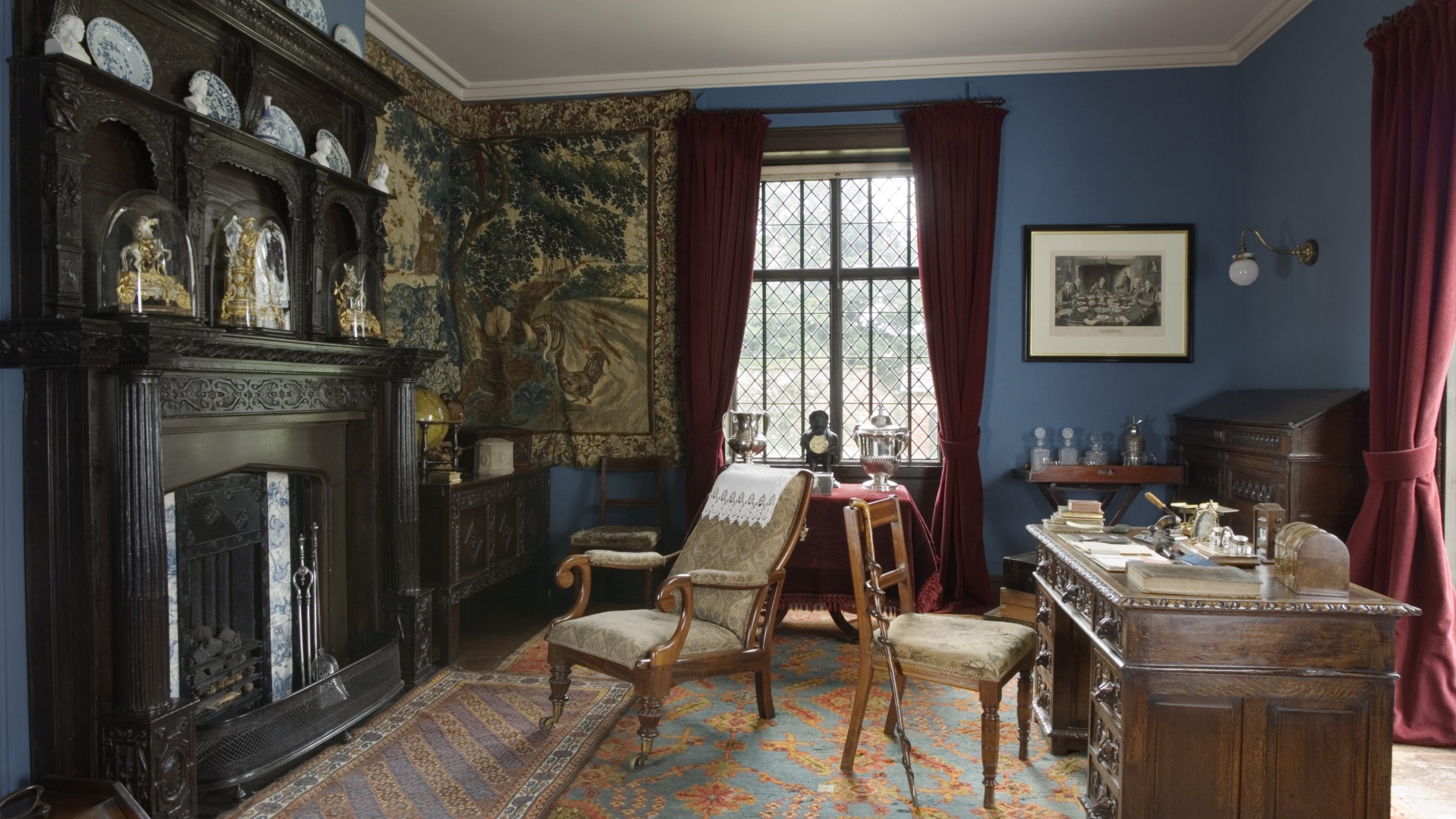 The study at Rufford Old Hall in Lancashire, showing period furniture and ornaments.