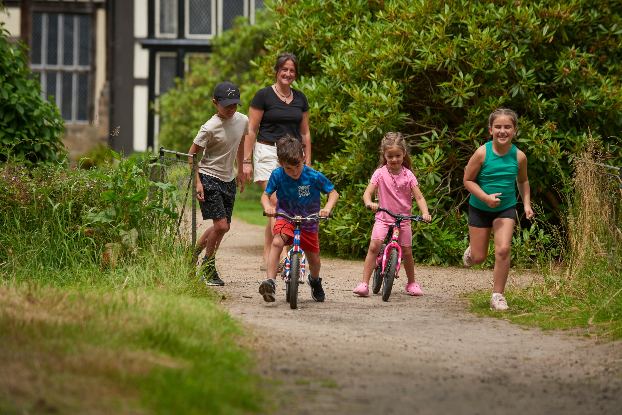Children enjoying the balance bikes at Rufford Old Hall