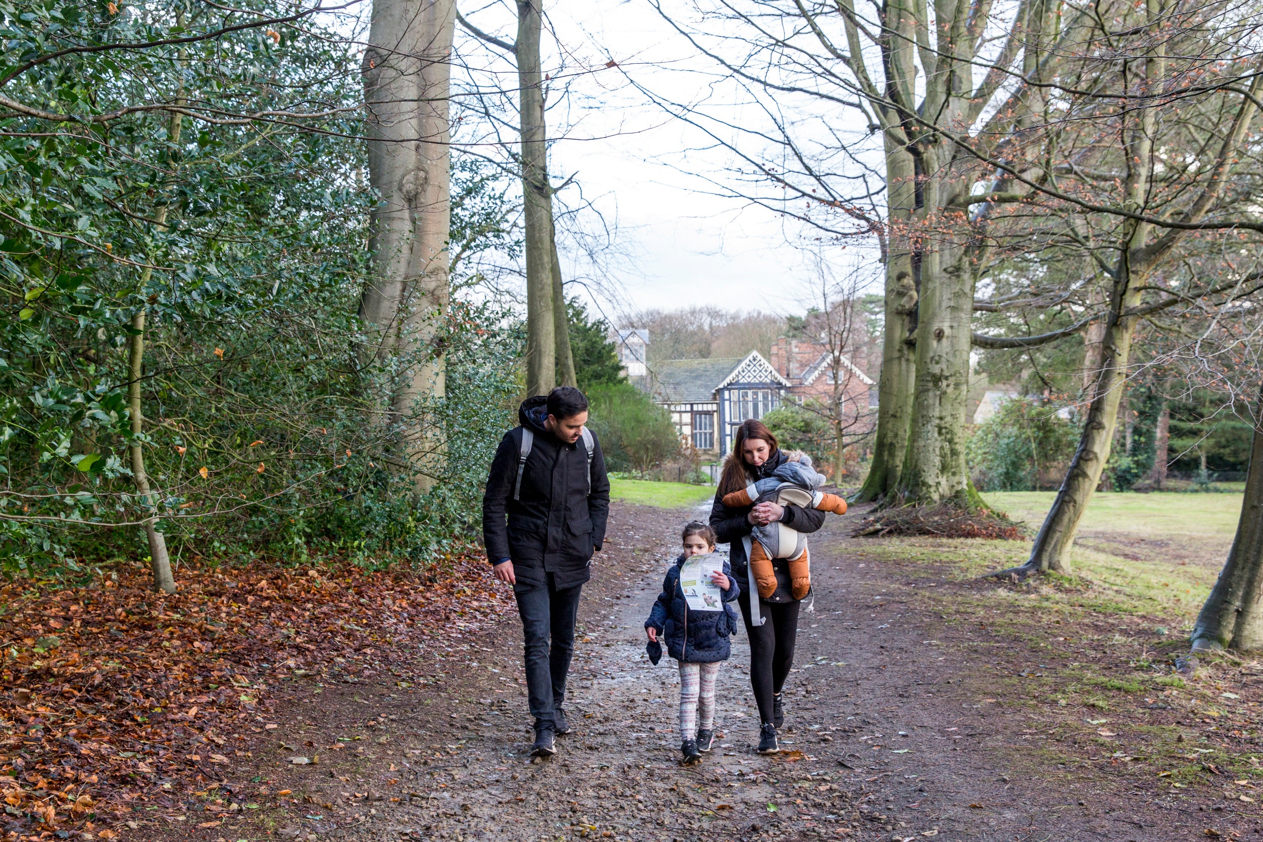 Family exploring Rufford's grounds in winter