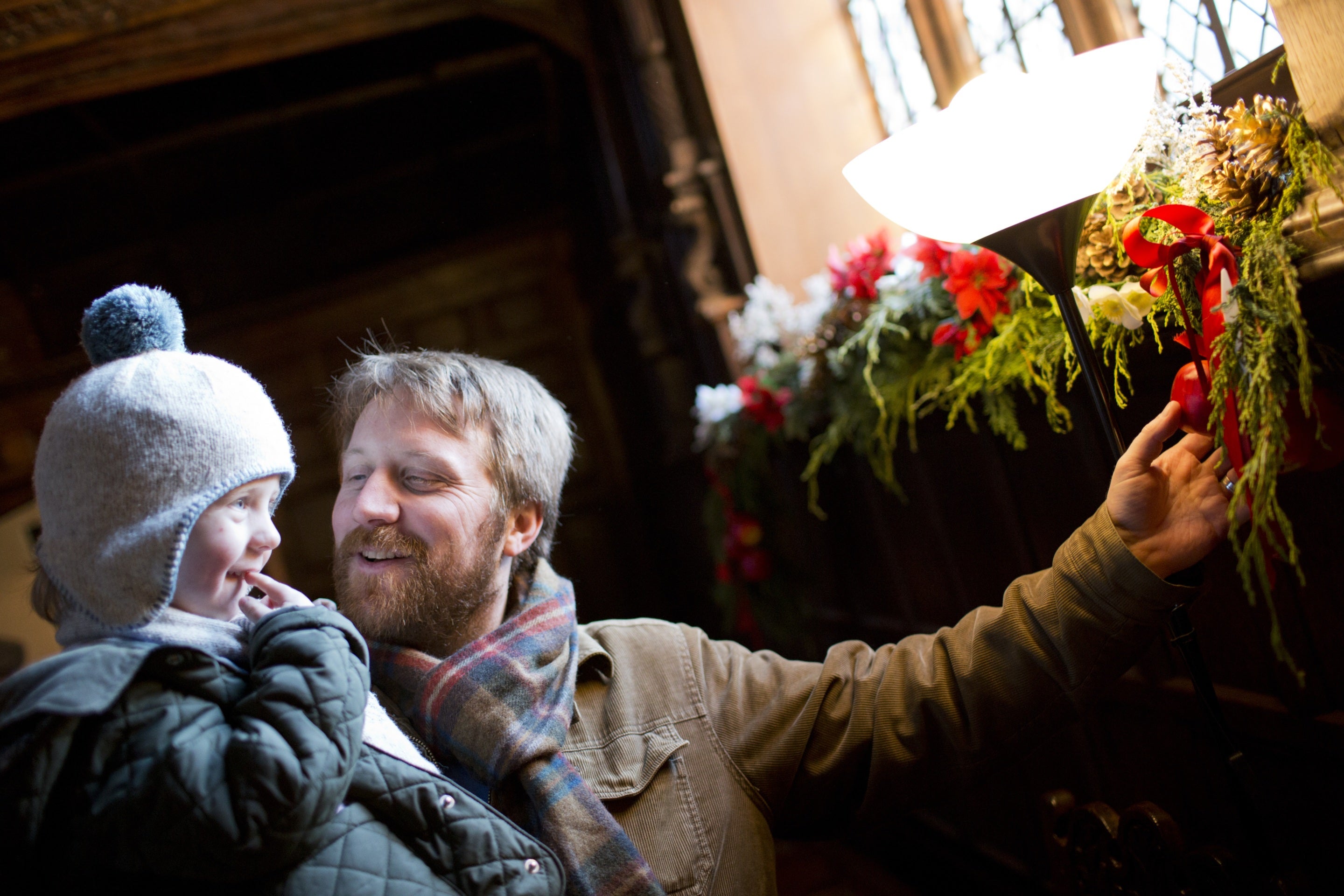 Father and son enjoying the Christmas decorations at Speke Hall, Liverpool