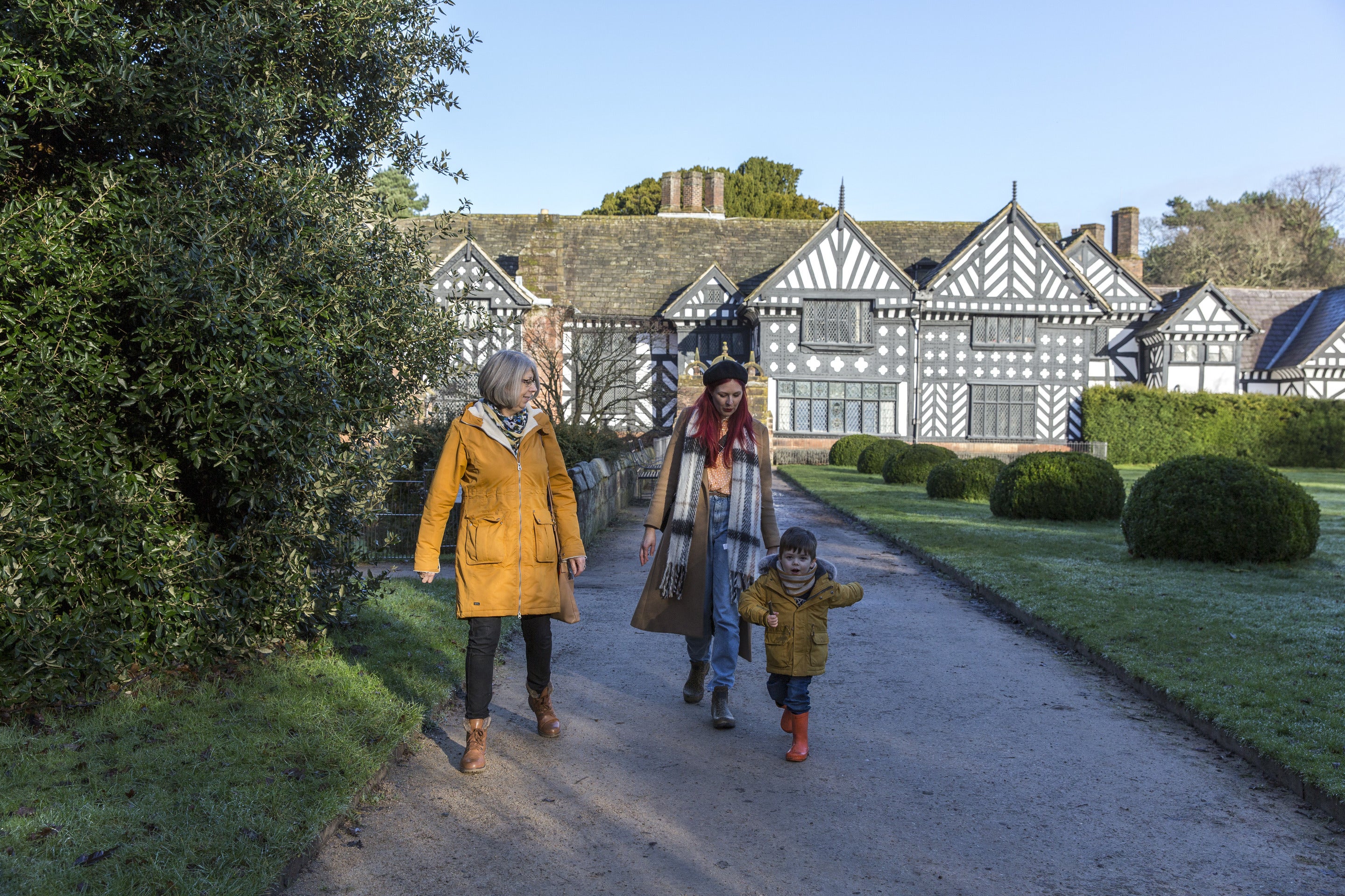 Family exploring the wintry garden