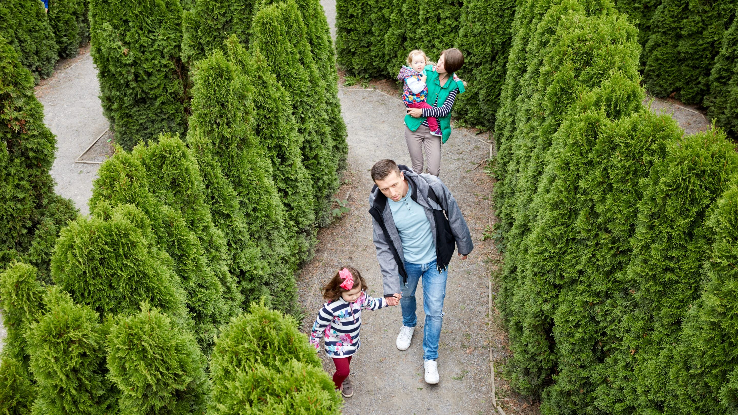 A family walking through a maze
