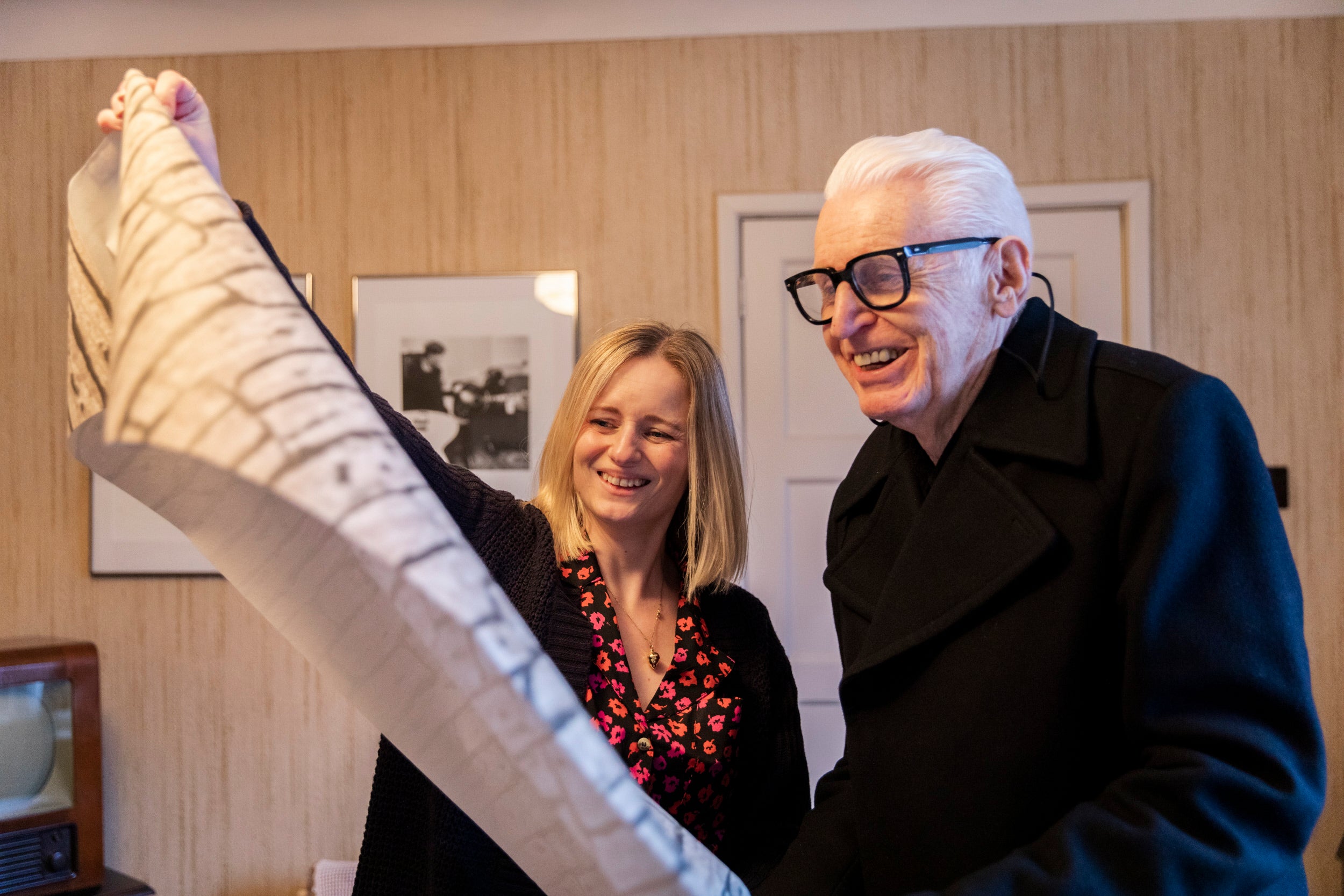Mike McCartney with curator Katie with rolls of wallpaper at Forthlin Road, The Beatles' Childhood Homes, Liverpool