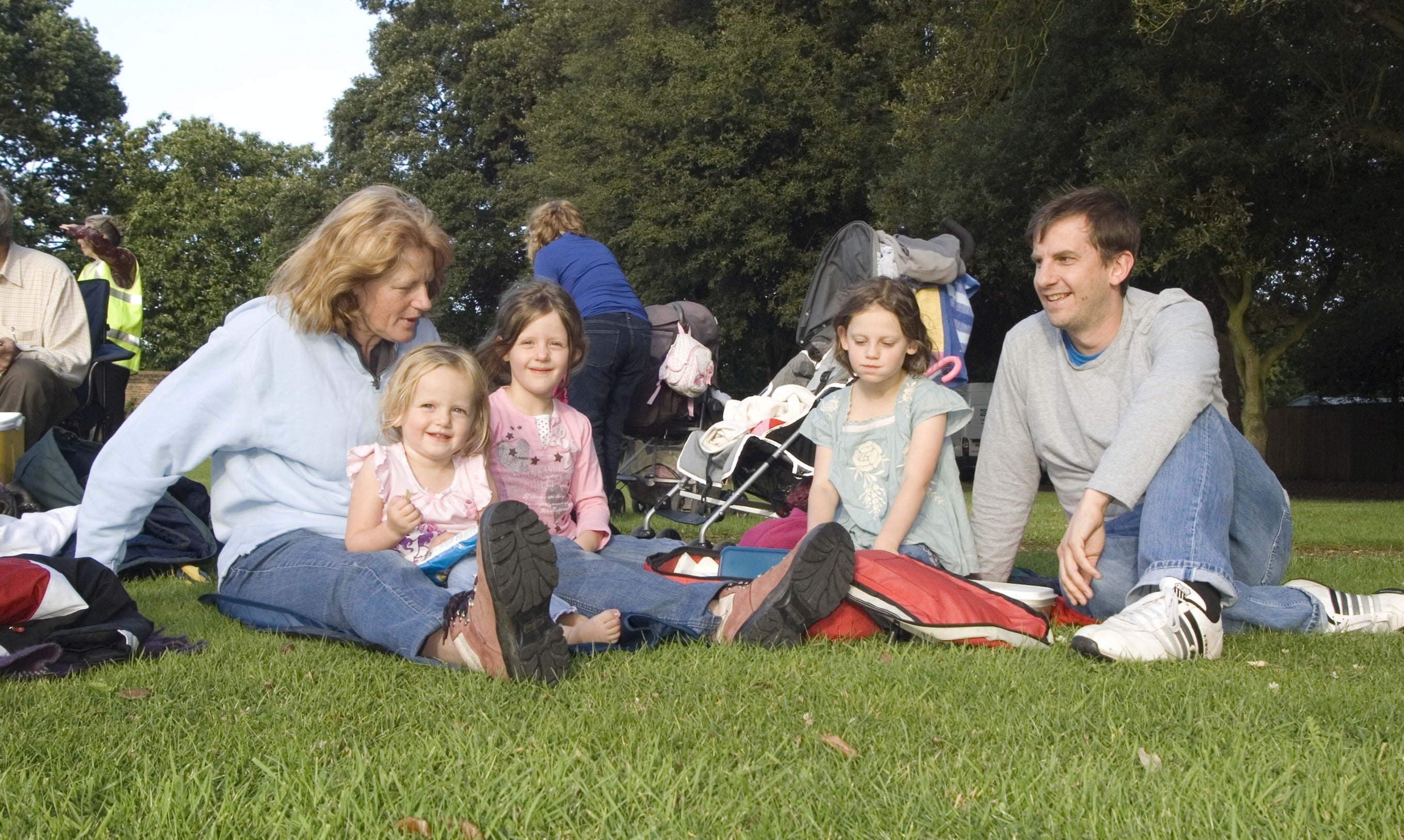 Family sitting down for the outdoor theatre at Ham House, Richmond-upon-Thames, Surrey