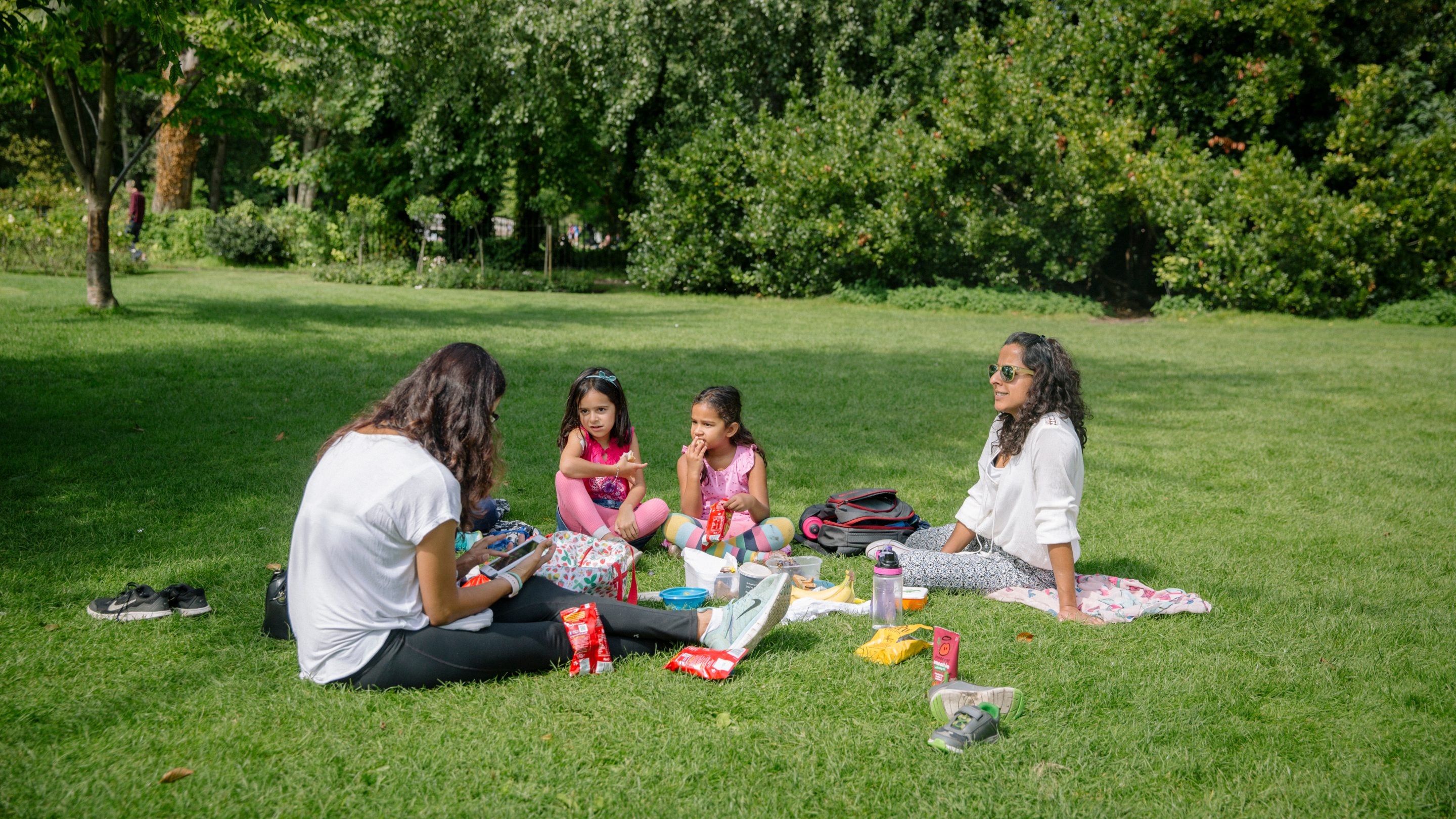 Visitors enjoying a picnic at Morden Hall Park, London