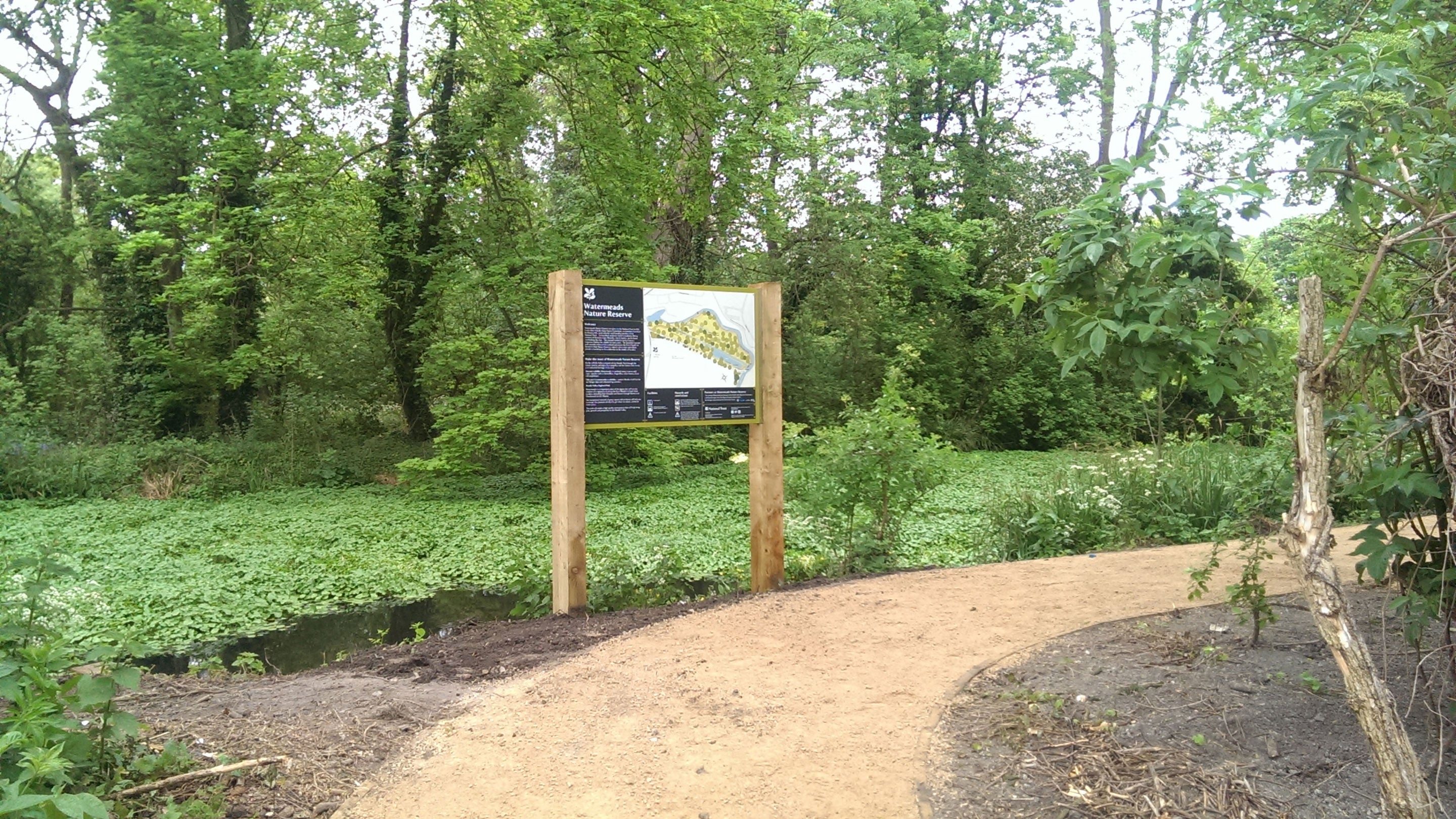 The curving path alongside the river at Watermeads Nature Reserve