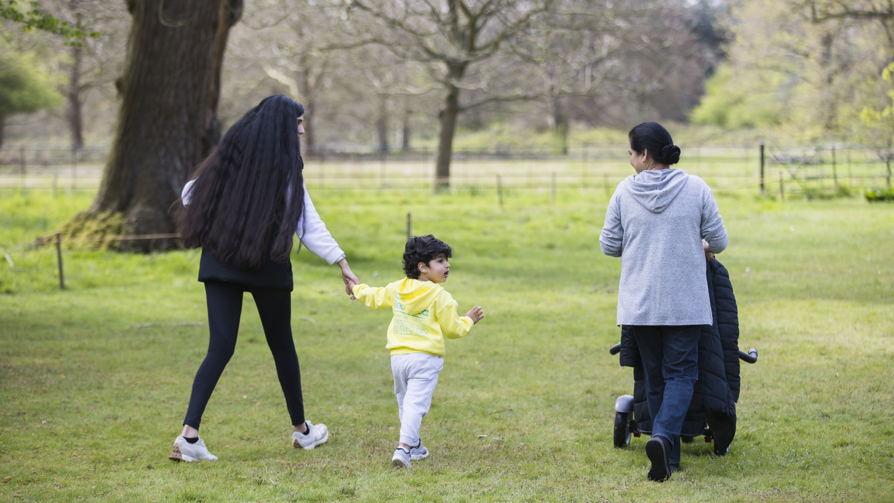 Family enjoying the open spaces in Osterley Park in spring