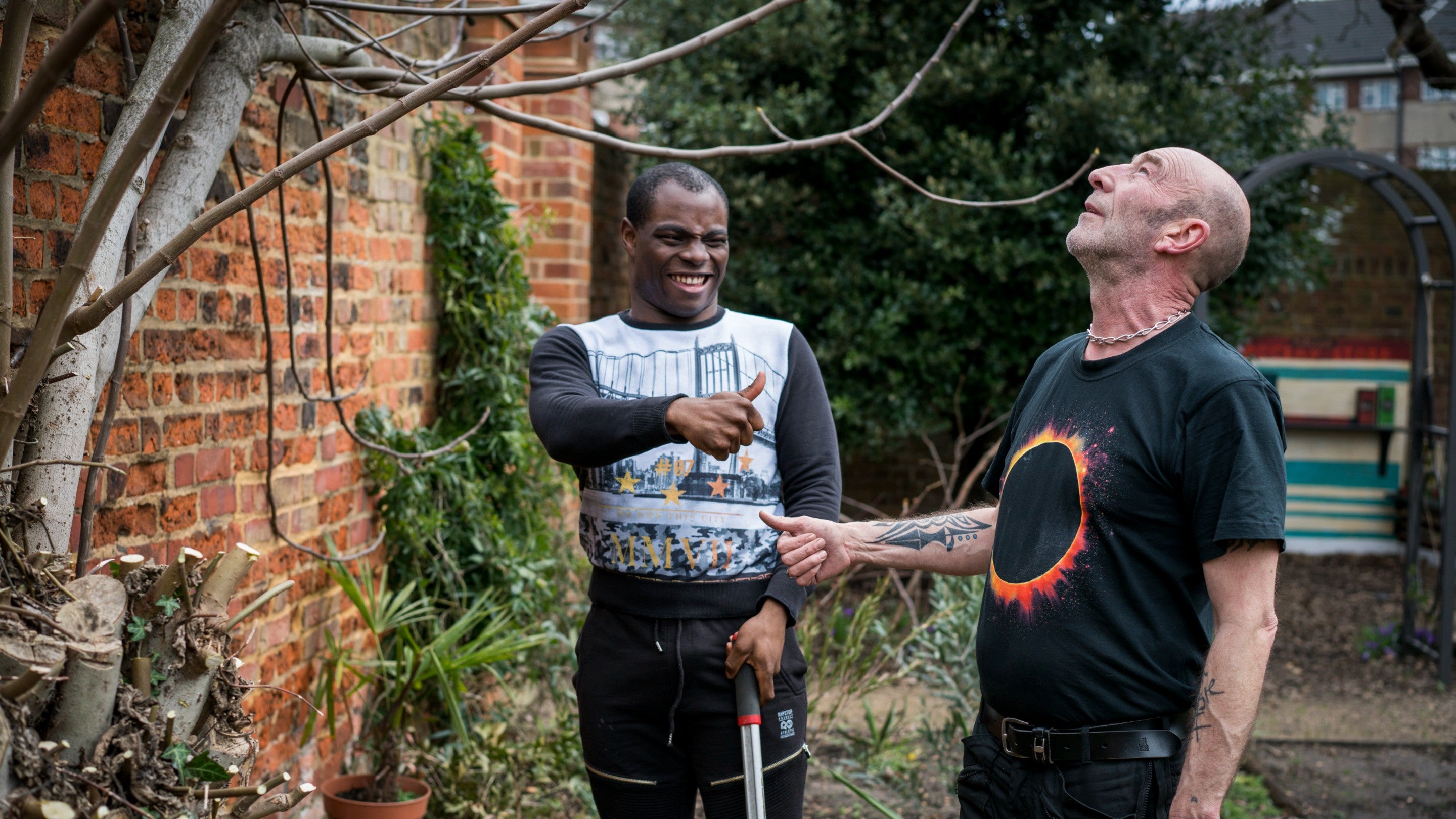 Volunteer and staff member in the garden at Rainham Hall, London