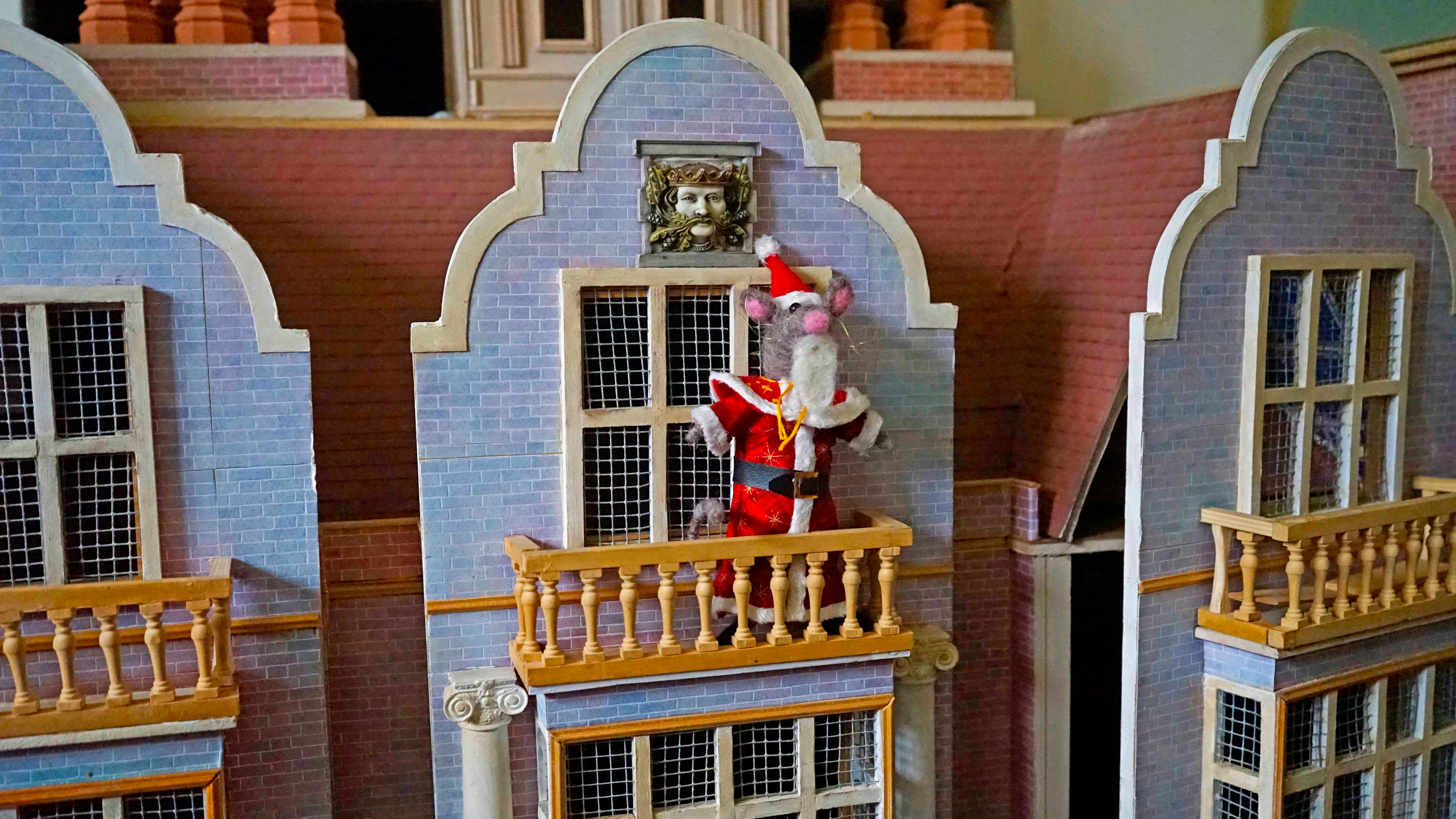 Father Christmas Mouse on the balcony of a model replica of Blickling Hall