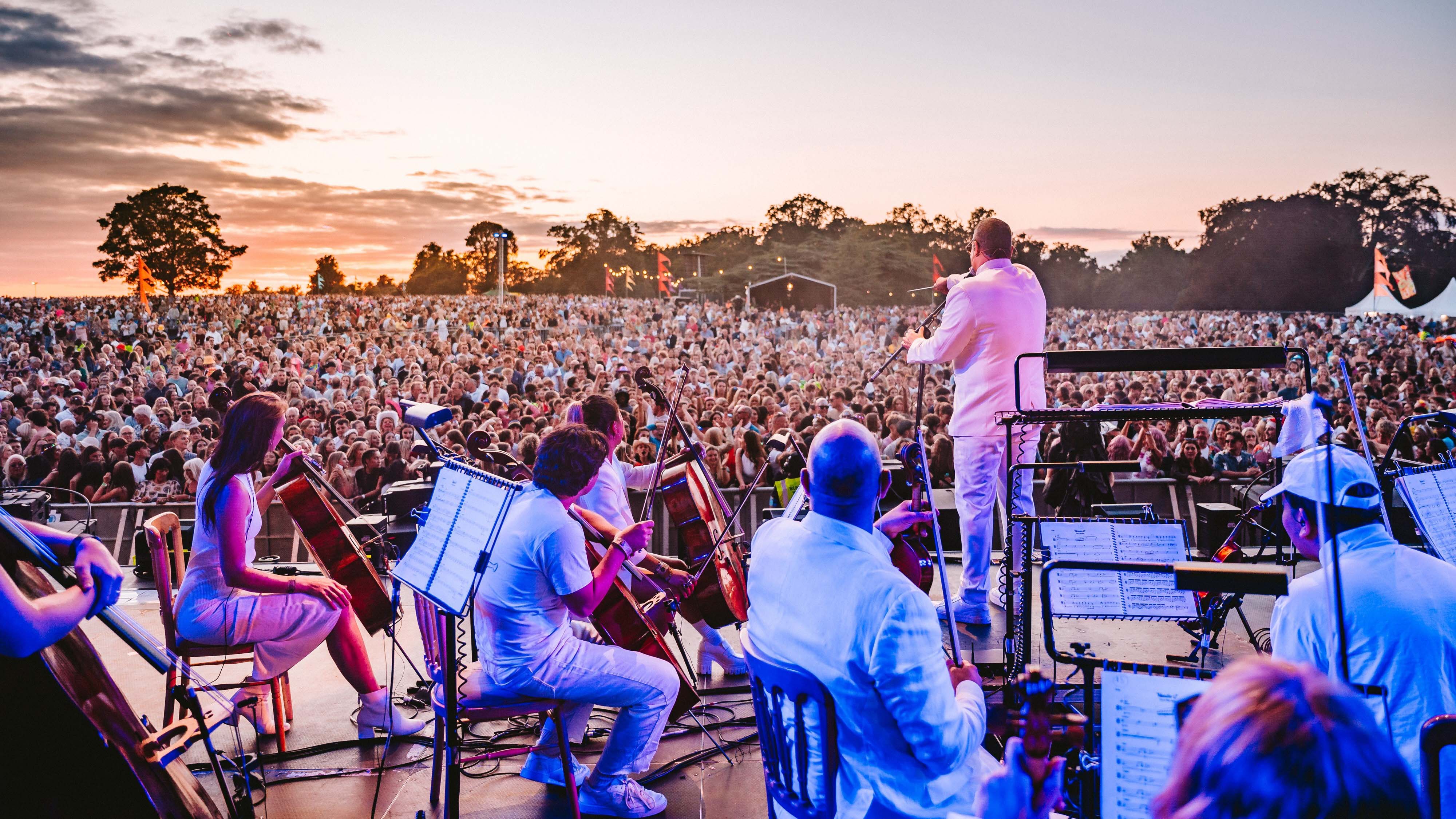An orchestra performing at the Classic Ibiza event at Blickling Estate, Norfolk