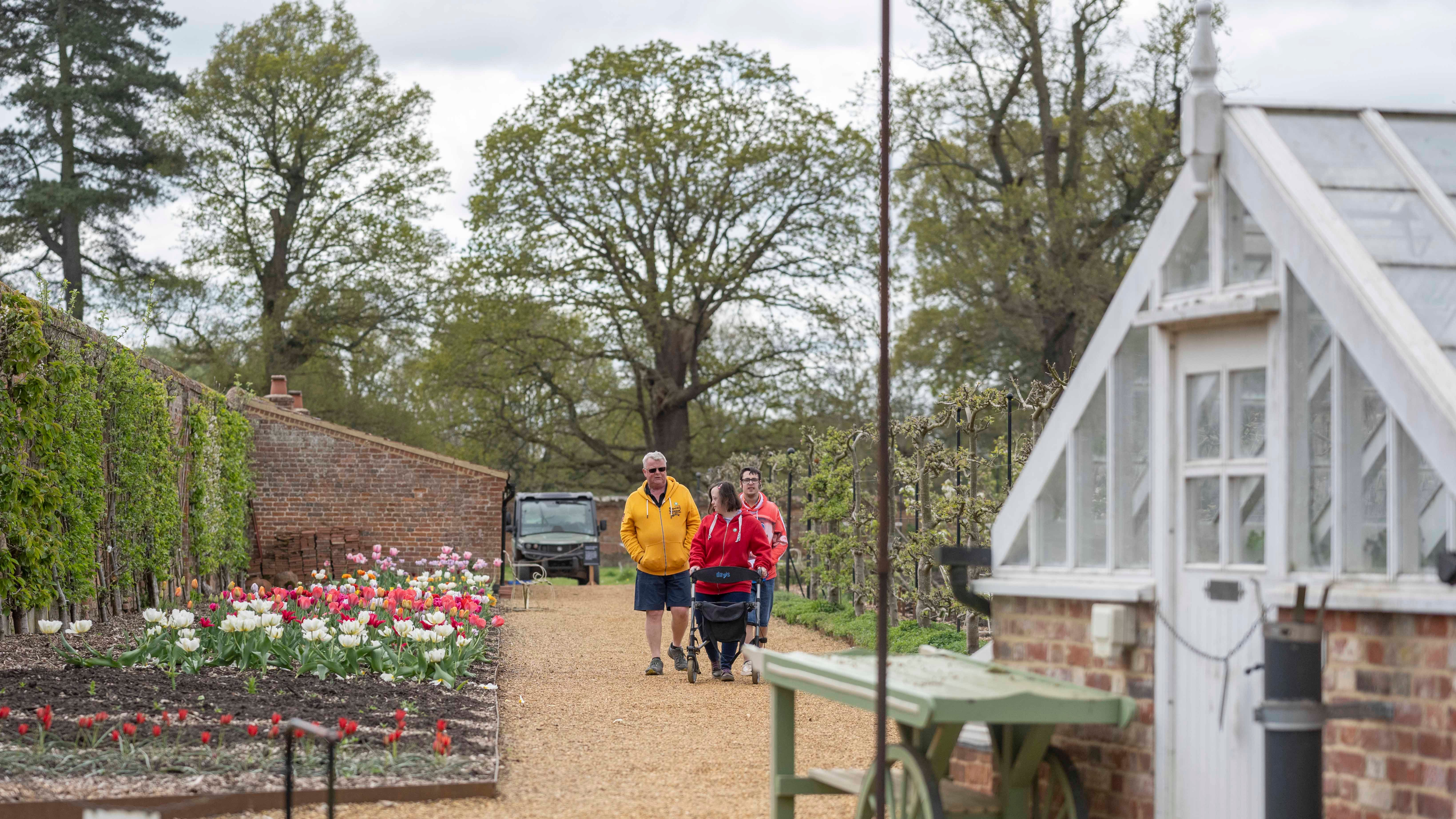 Visitors exploring the walled garden at Blickling Estate