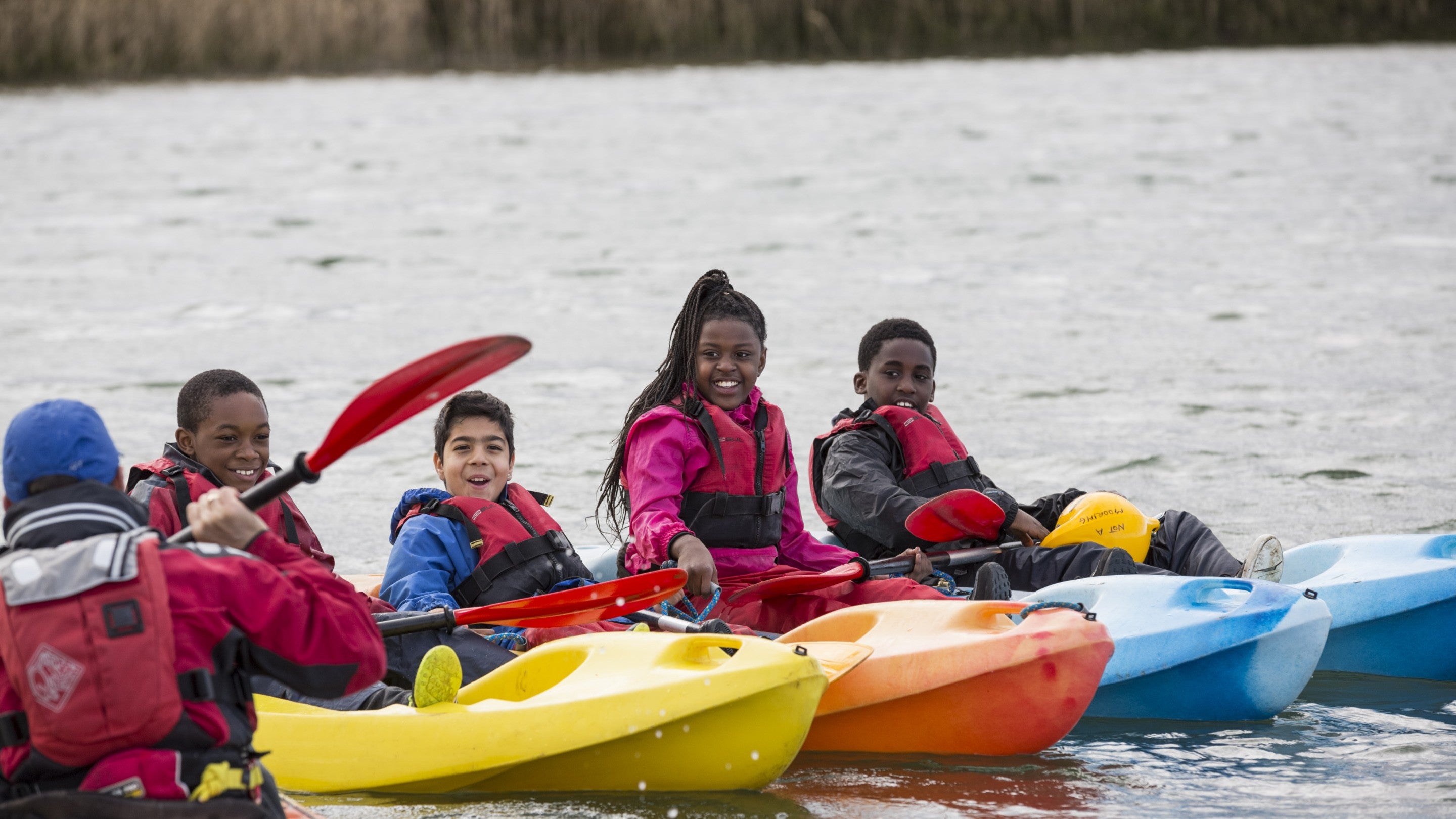 Children kayaking at Brancaster Activity Centre, Norfolk