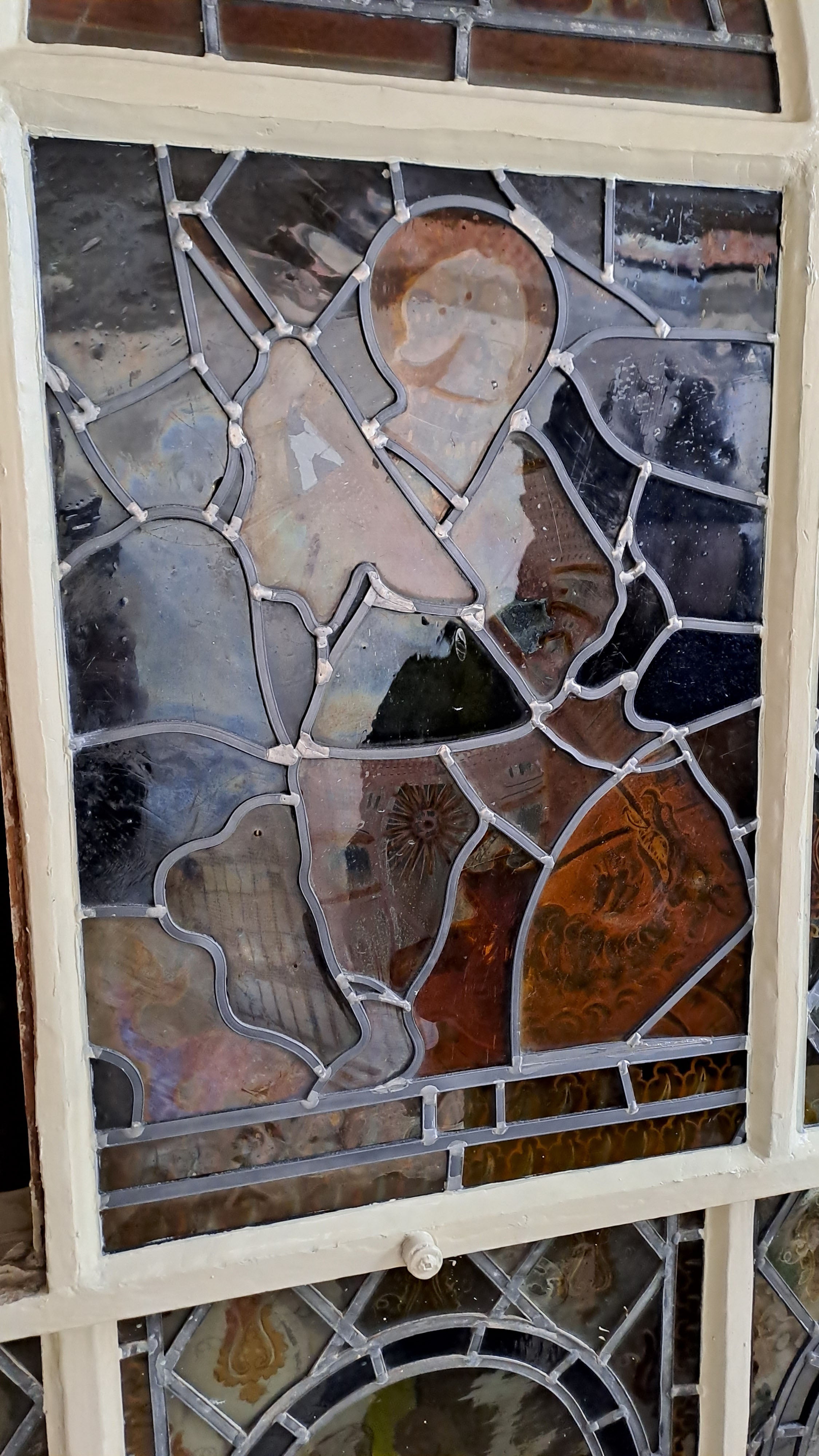 Conserved glass panel viewed from the outside at the Elizabethan House, Great Yarmouth