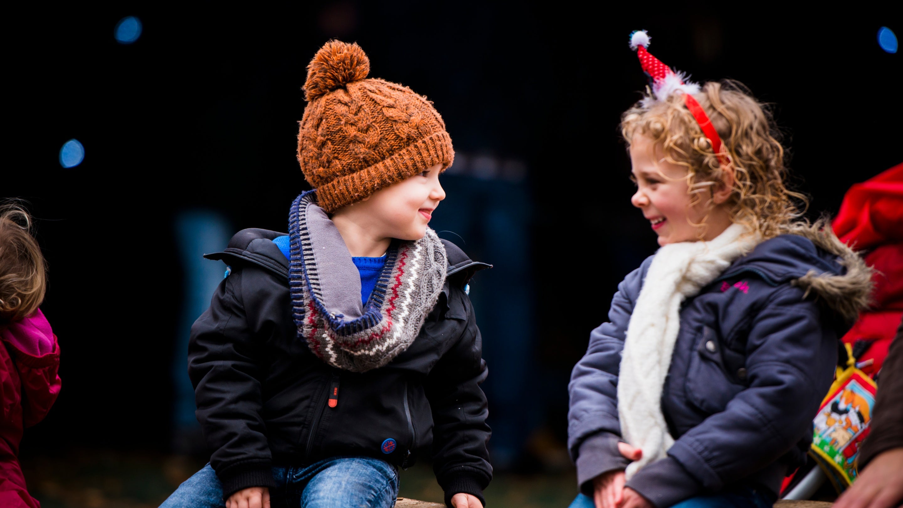Children wrapped up warm in hats, scarves and winter coats enjoy a festive day out during Christmas celebrations at Felbrigg.