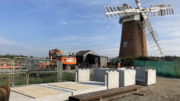Pre-cast concrete units that form the pump support slab and control building base with Horsey Windpump behind