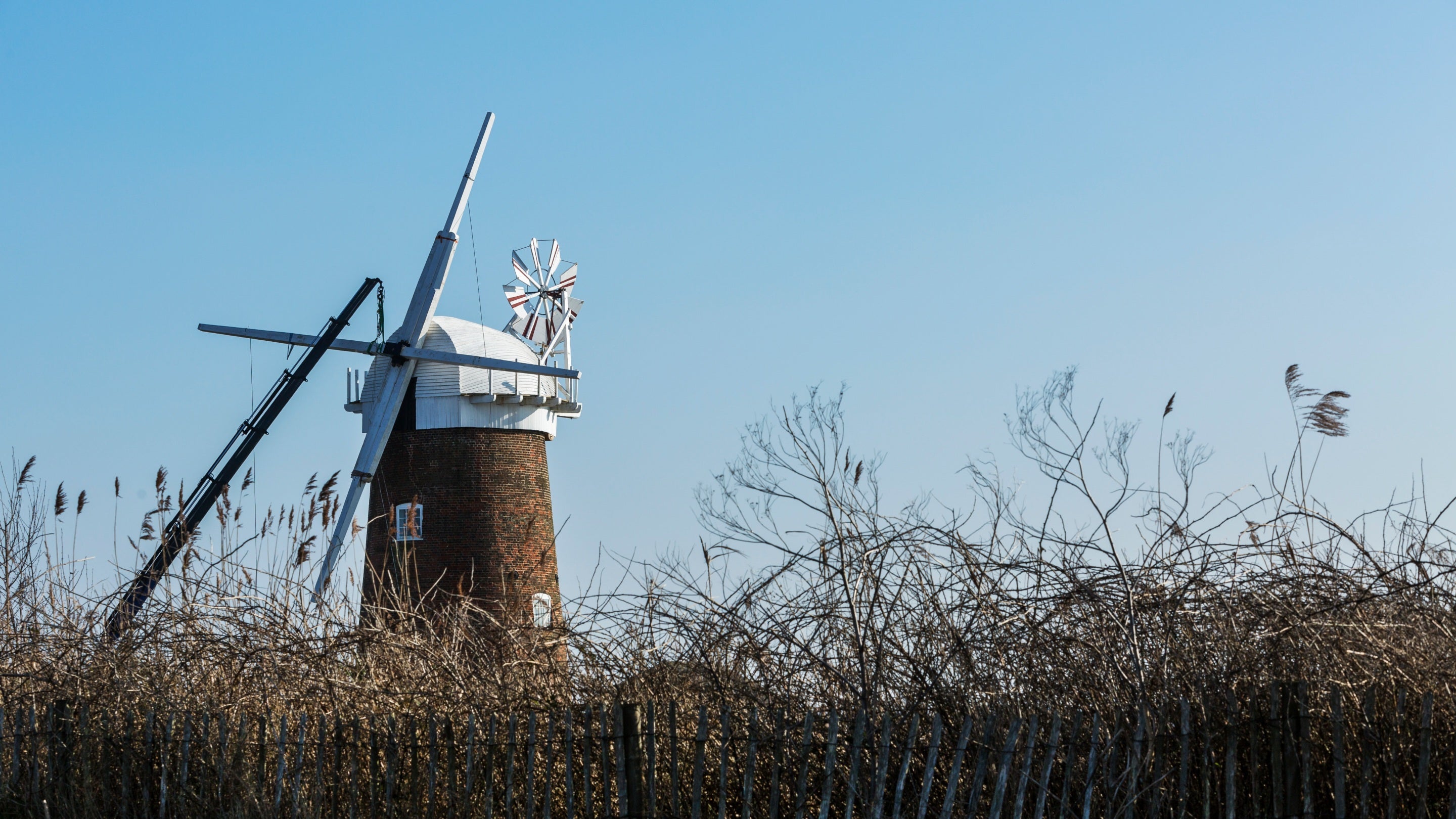 Installing the new stocks and sail frames during the restoration project at Horsey Windpump, Norfolk