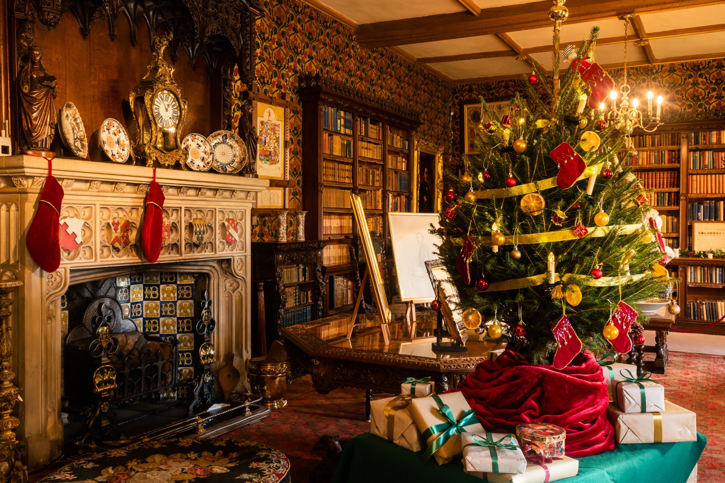 Traditional Christmas decorations in the Library at Oxburgh Estate Norfolk